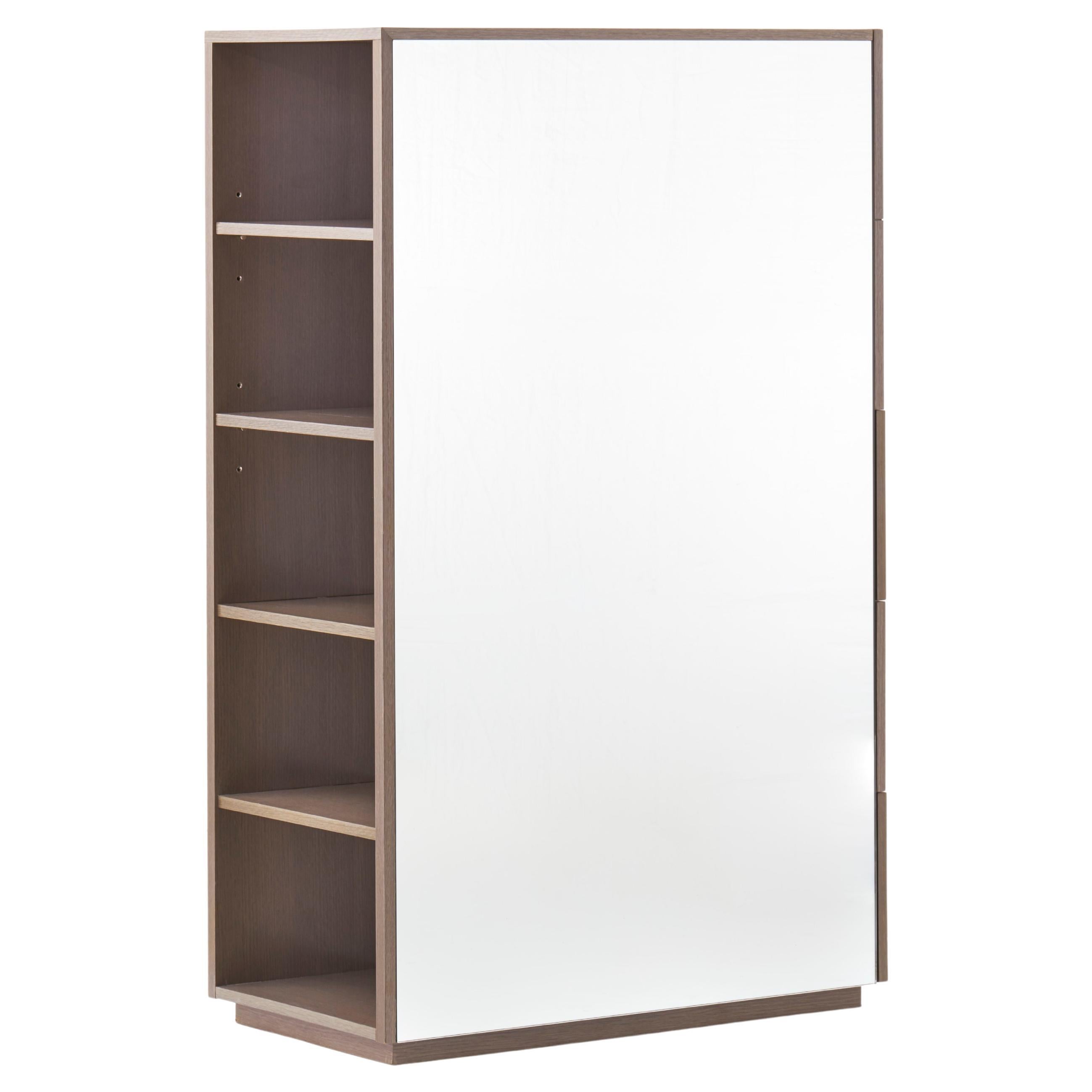 No. CG-001

The Mirrored Cabinet packs a lot of functions into one unit. Available with drawers or shelves accessible from the sides, it has a mirrored front and bacl, reflecting light and movement in the space. 

Its mirrored surfaces comes alive