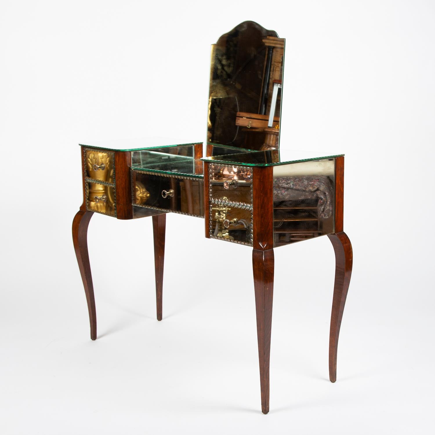 A French mirrored dressing table.

With cabriole legs, central drawer and two drawers either side.

With patterned edged mirror plate and knobs.

The back mirror can be removed so the table can be used as a small desk.