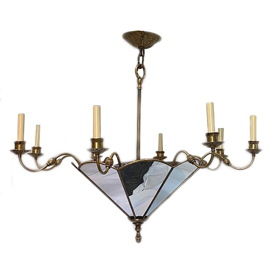 A circa 1940's French patinated bronze eight-arm chandelier with mirror insets and interior lights. 

Measurements:
Diameter: 42