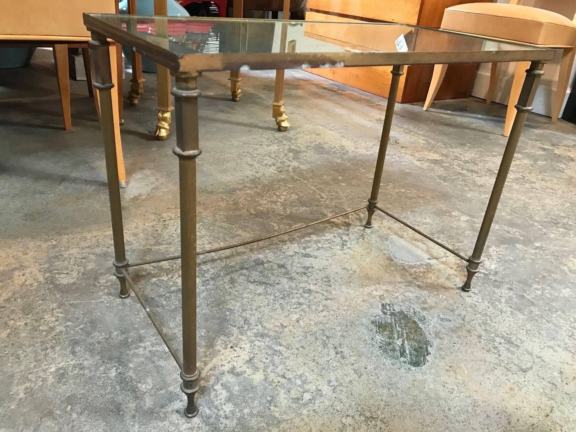 A set of two mirrored French nesting tables.