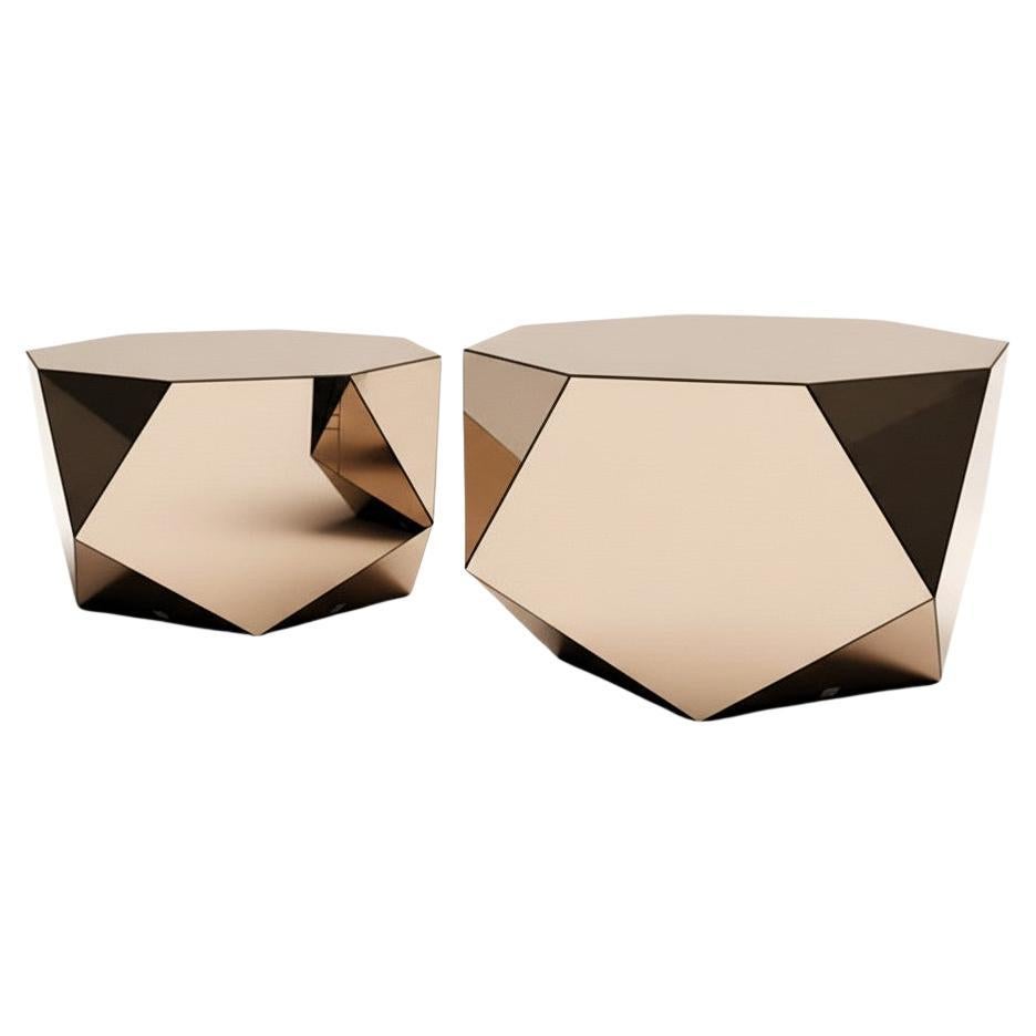 Collectible pair of faceted coffee tables handcrafted from mirrored glass, forming a pair of sculptural objects that blur the boundary between furniture and contemporary art. 

When viewed from the top or bottom, each table reveals an octagonal