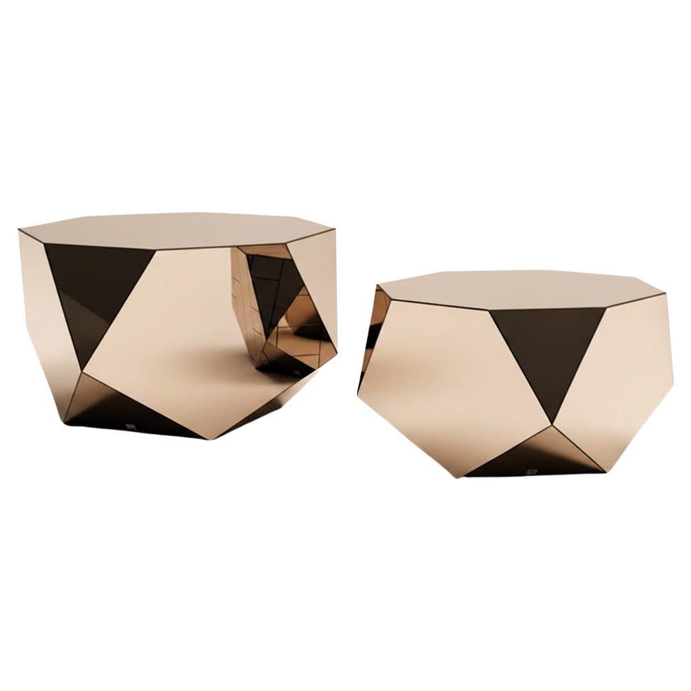 Collectible pair of faceted coffee tables handcrafted from mirrored glass, forming a pair of sculptural objects that blur the boundary between furniture and contemporary art. 

When viewed from the top or bottom, each table reveals an octagonal