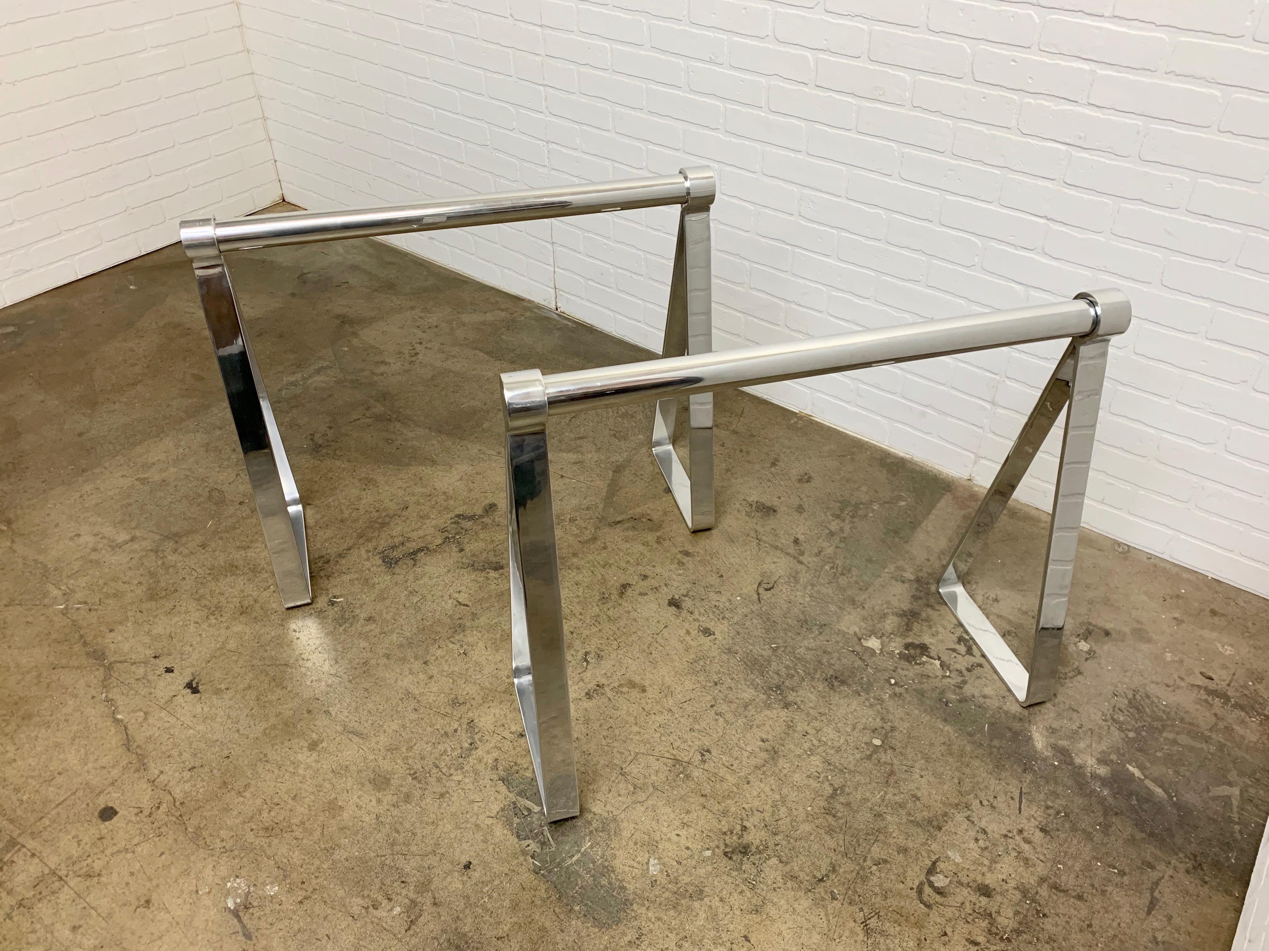 Professionally polished aluminum sawhorses in the Campaign style. Can be used as a desk or dining table. Each saw horse measures: 34.1/8