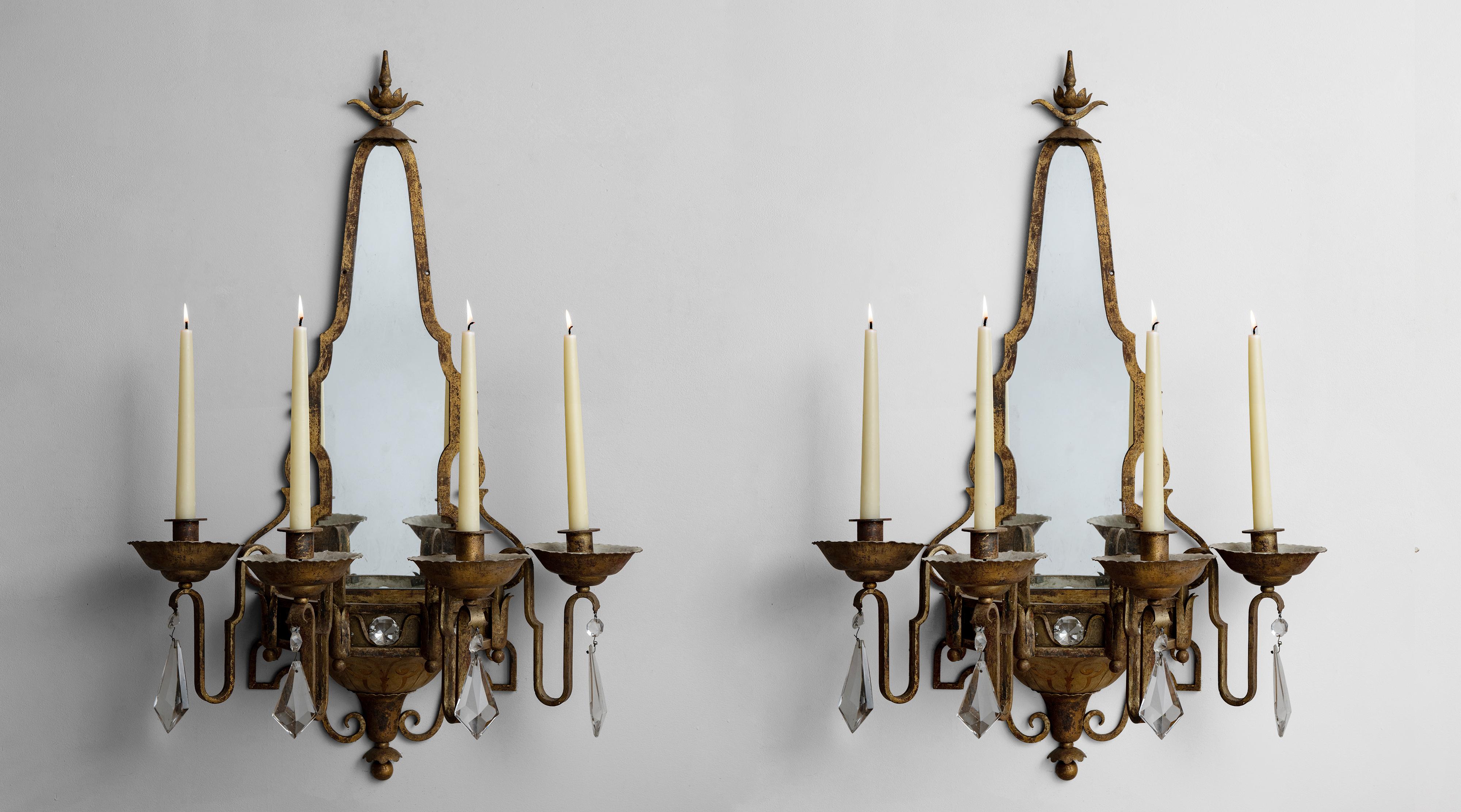 Mirrored sconces, France, circa 1940

Decorative brass and crystal wall sconces with (4) taper candles in front.

*Please note the price is per unit, and the lights are sold individually*