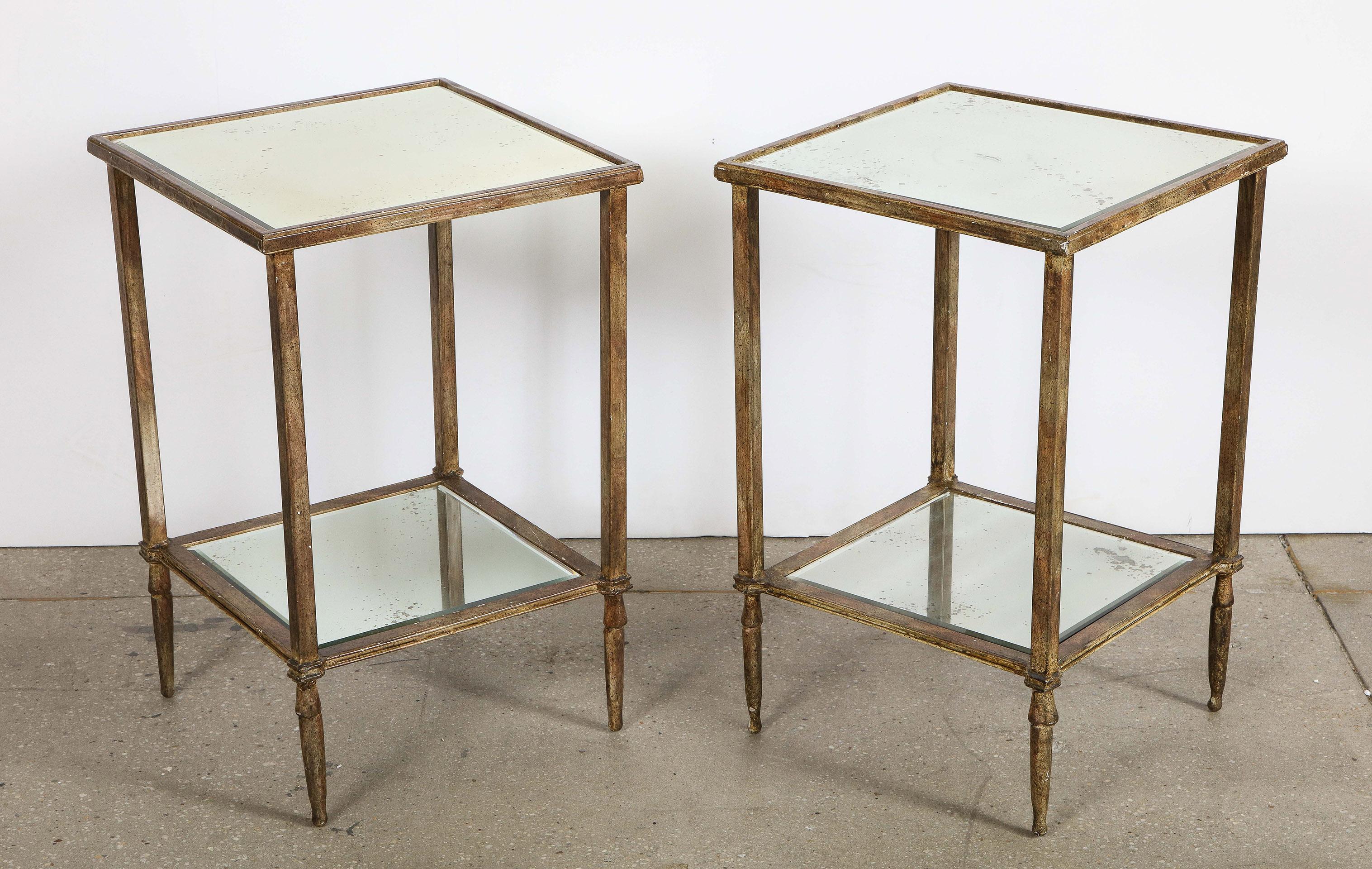 Pair of painted iron and mirrored tables

The painted iron frame with two mirrored shelves.