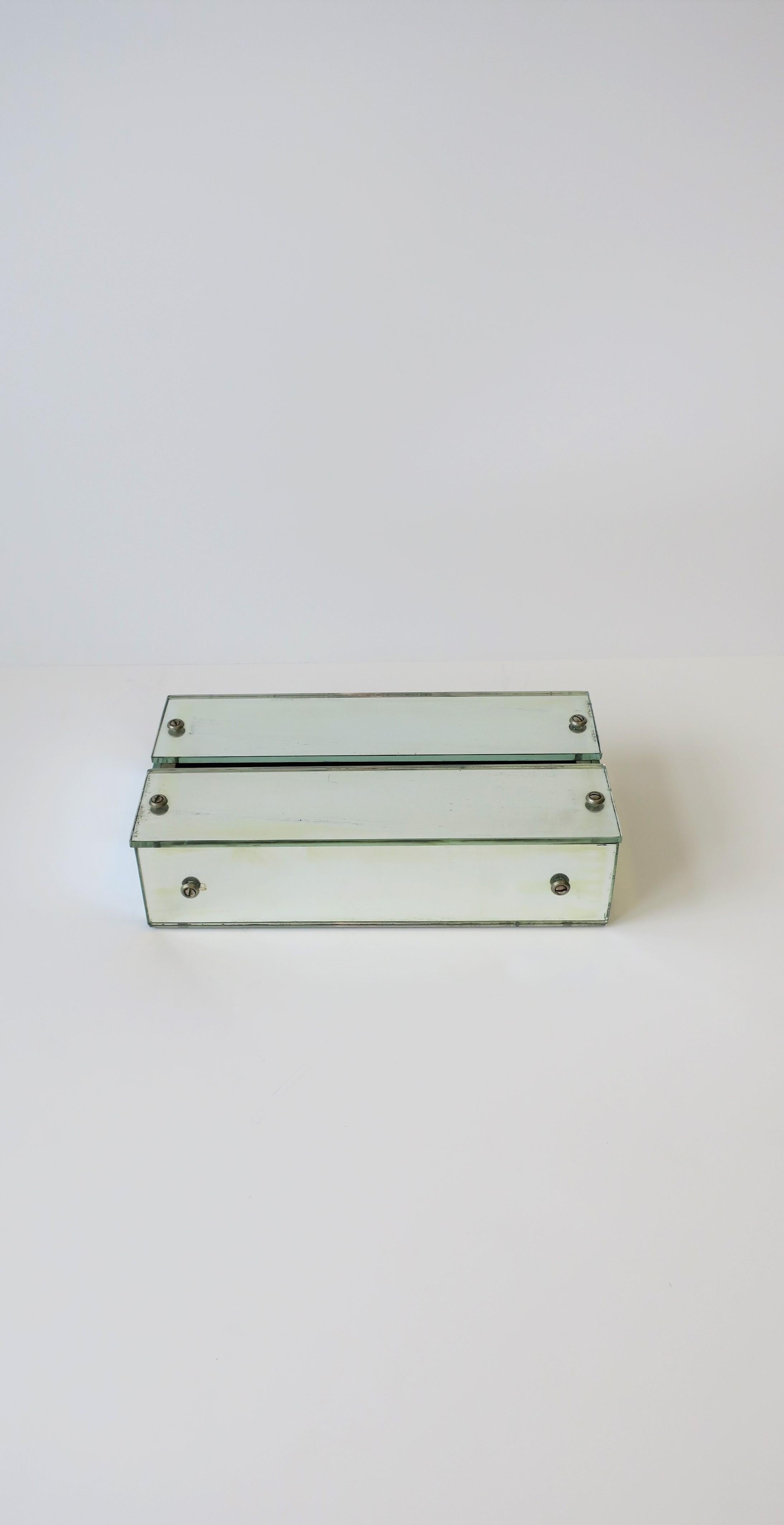 A chic '70s Modern or Postmodern [Post-Modern] mirrored tissue holder box with metal screw detail, circa 1970s. Box opens on bottom (slides out), please see images #12 and 13. A great piece for any office, vanity area, bathroom, etc. Hold standard