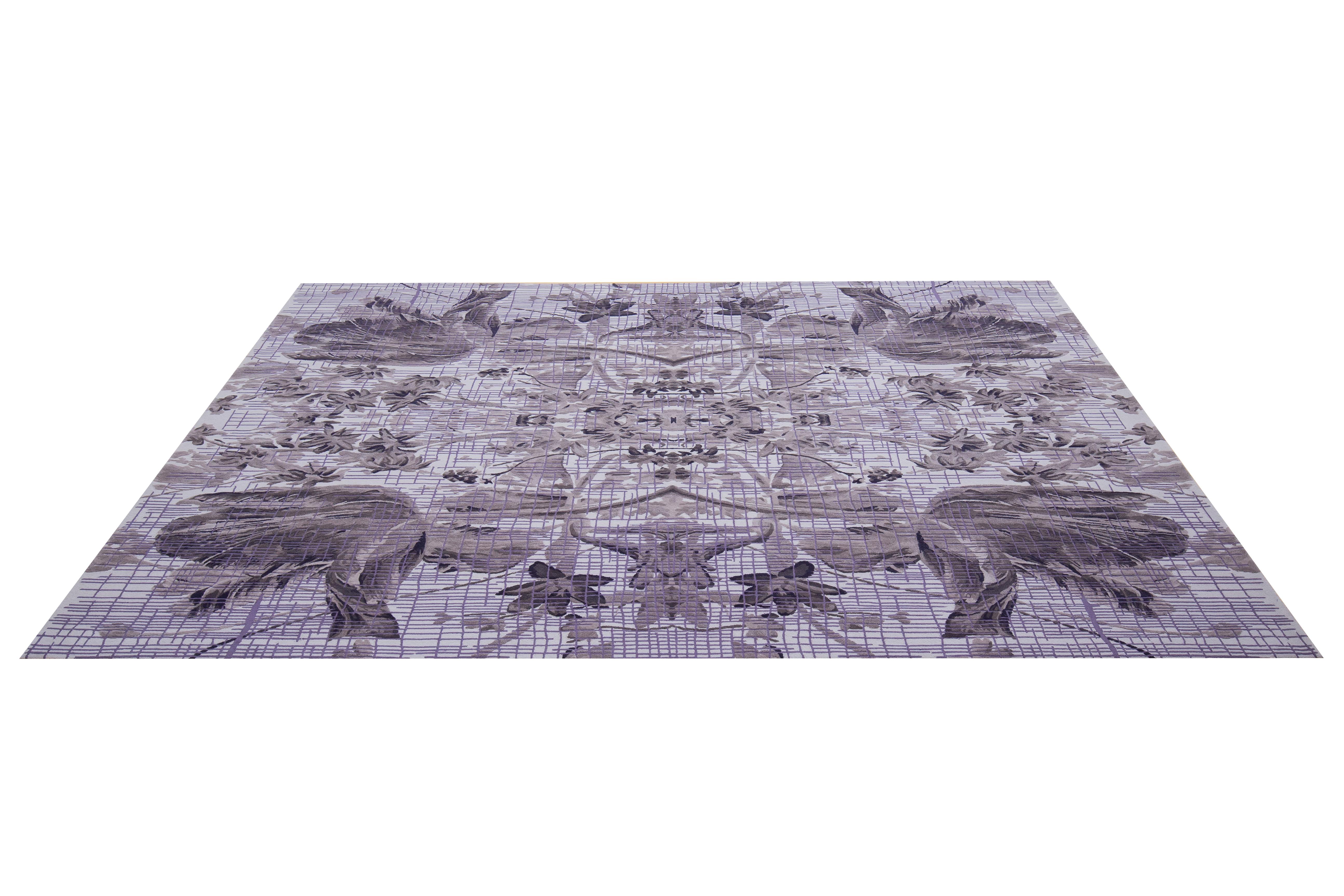 Reminiscent of the Garden of Eden, Omar Khan composes symmetrical flowers in swathes of ombre periwinkle tones that rhythmically dance across the face of the rug. 

Mirrored tulips is layered, highly-detailed, and meticulously hand-tufted in silk