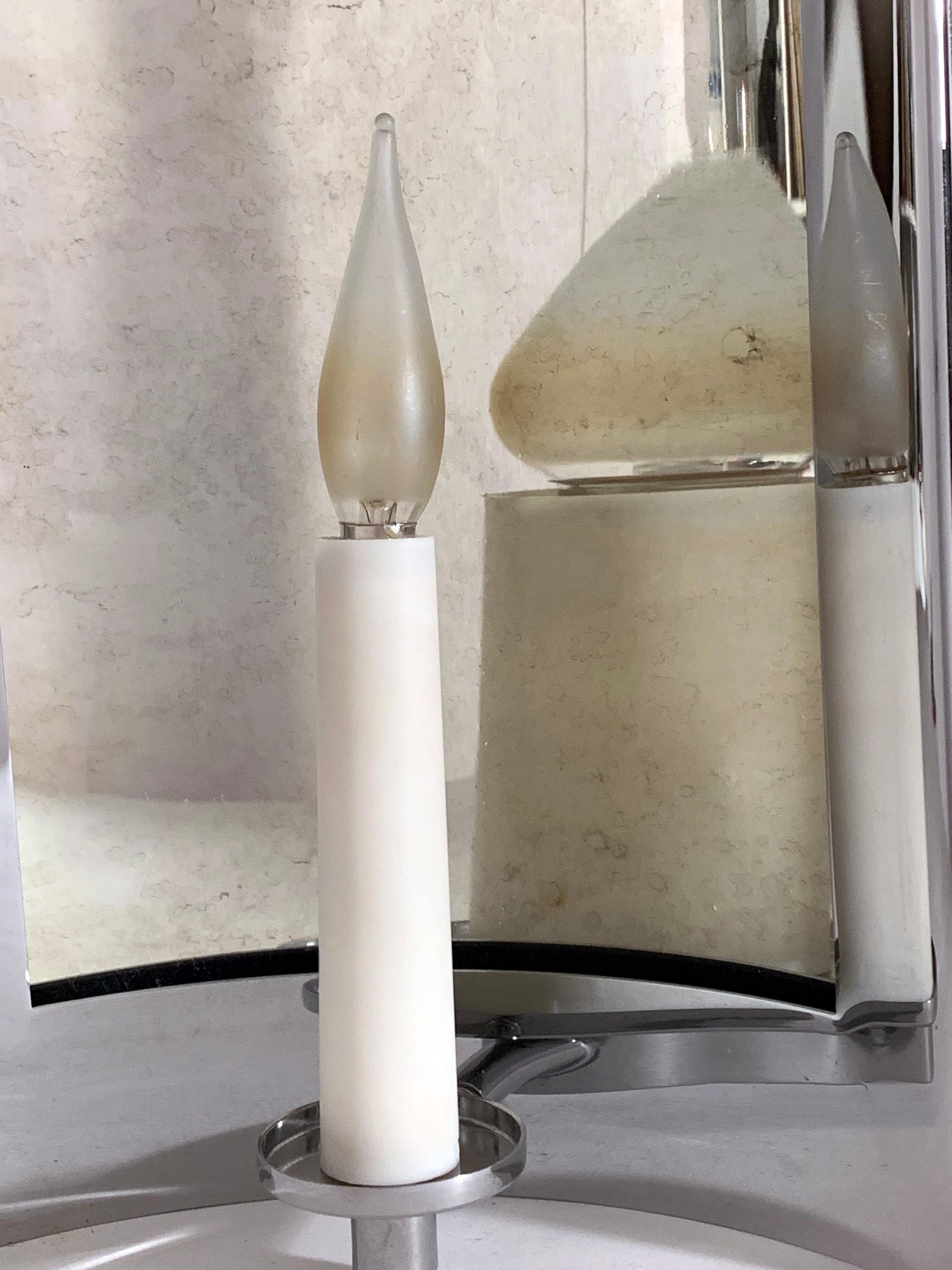 Original prototype.
A curved antiqued-mirror reflector set in a nickel frame with candle. 
Mirror magnifies the candle and bulb.
Made in Italy.