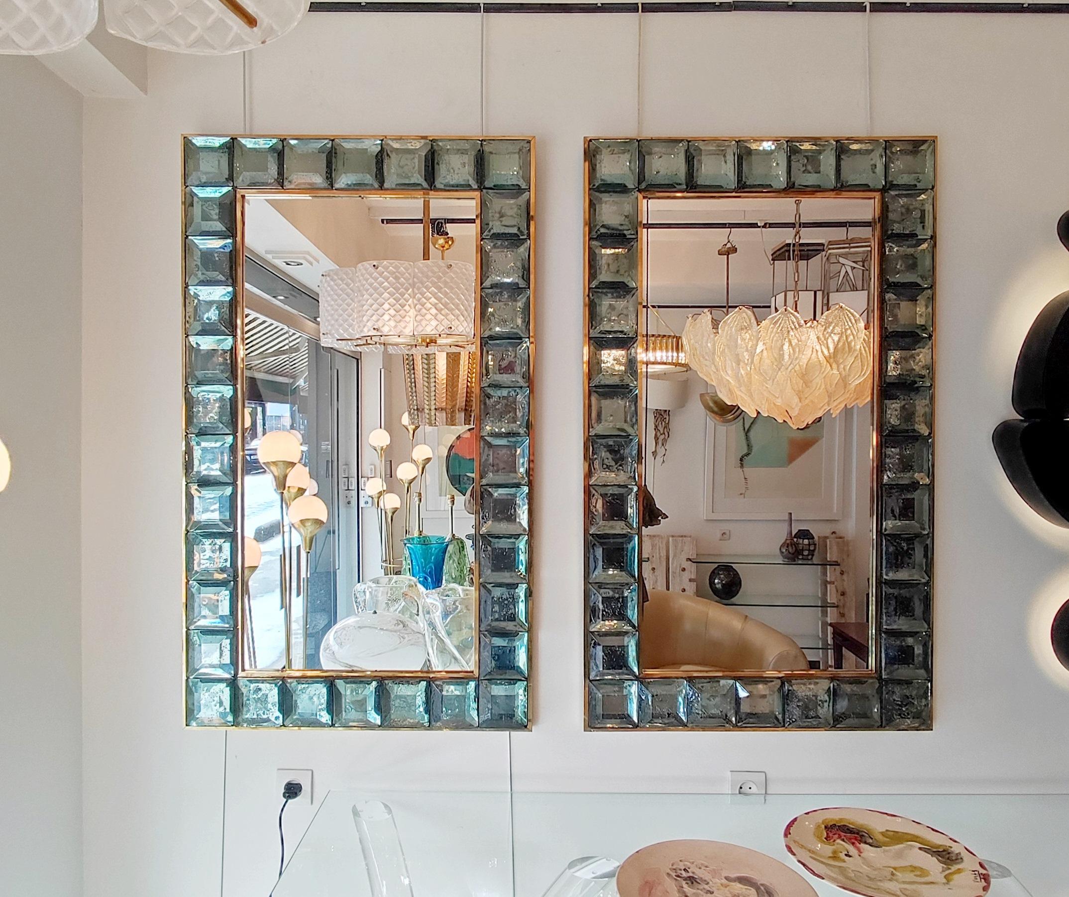 Pair of Mirror made of 34 truncated pyramids ( celadon green Murano glass) in a brass frame
(on wood panel)
Measures: 123 cm x 73 cm
Height or width position.

Only one possible upon request.