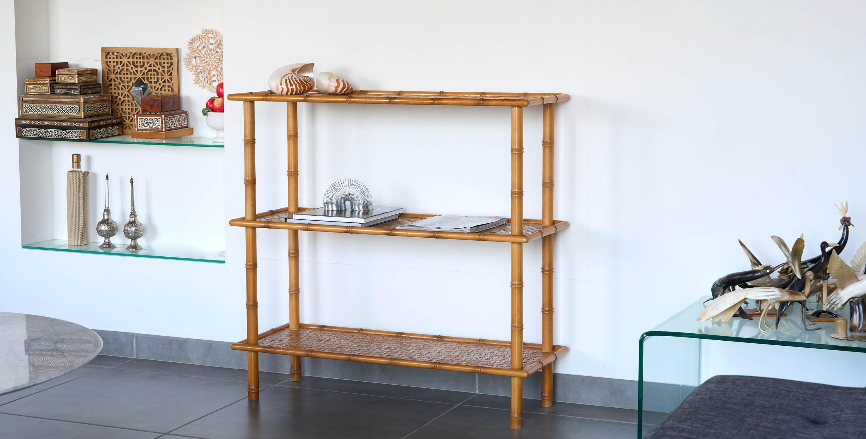 French vintage console from 1960-70, Roche Bobois by Maugrion.

Product description
Vintage console, dating from the 1960s-70s bamboo & rattan design.
This vintage console features 3 trays covered with rattan weave. It fits into any room in the