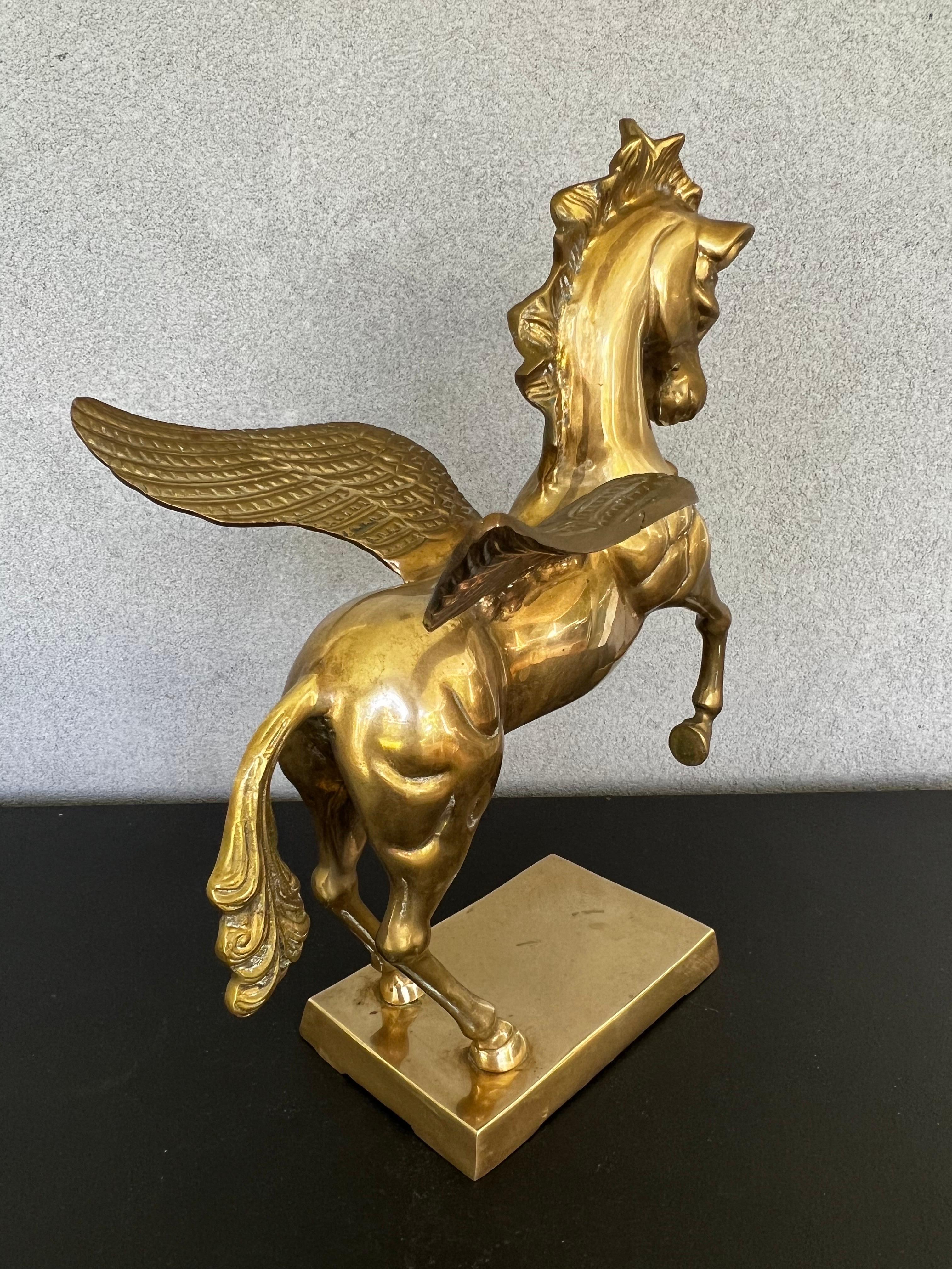 Heavy, Bronze, standing pegasus horse with wings on a rectangular brass base. Nice details on wings and horse. Pegasus was an immortal winged horse according to Greek mythology. Perfect for your collection. Very good condition. Weights over 15