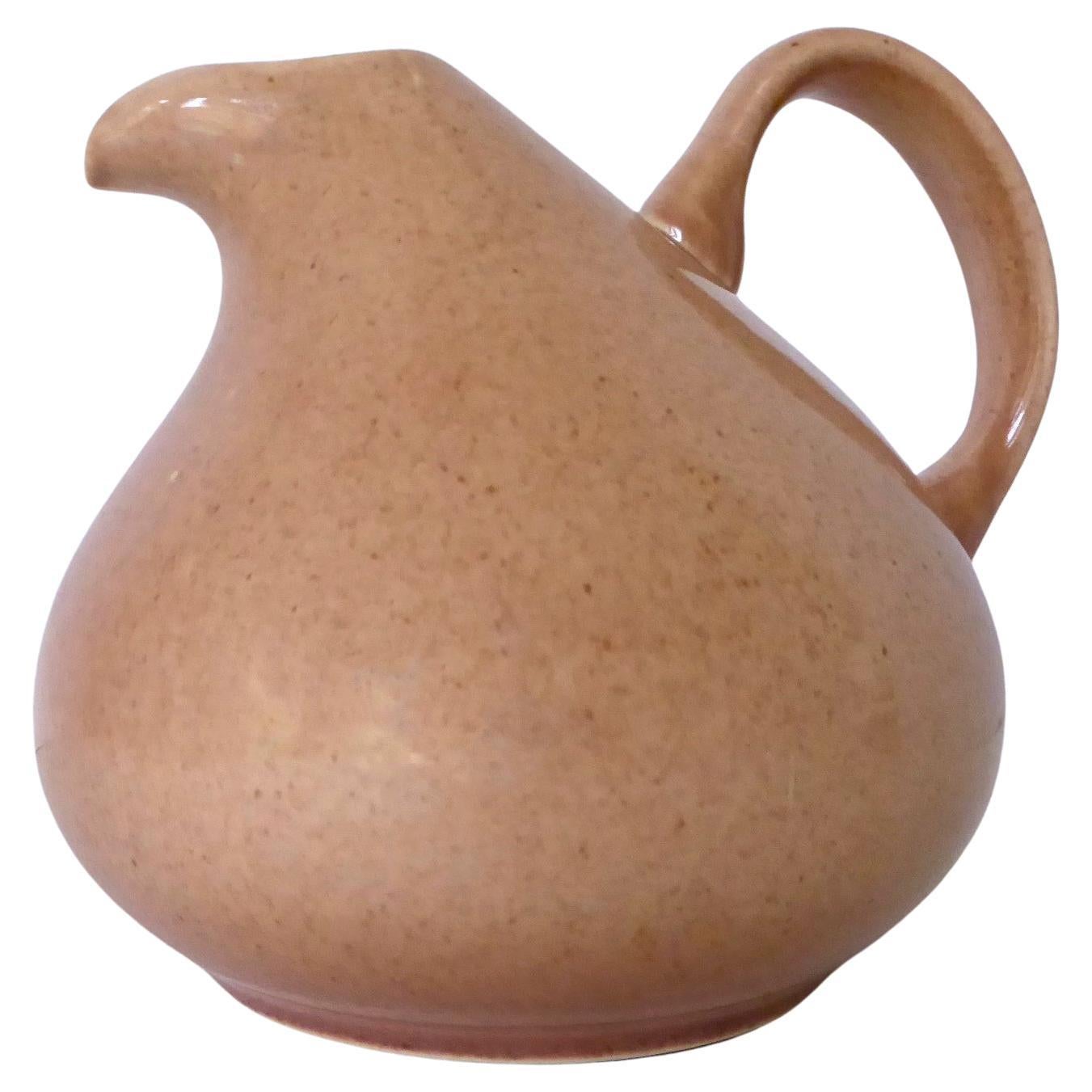 Mid Century Russel Wright (1904-1976) Coral American Modern carafe / jug / pitcher designed in 1937 and originally produced of sturdy earthenware by Steubenville Pottery (later made by Bauer Pottery of California). Popular collection of modern