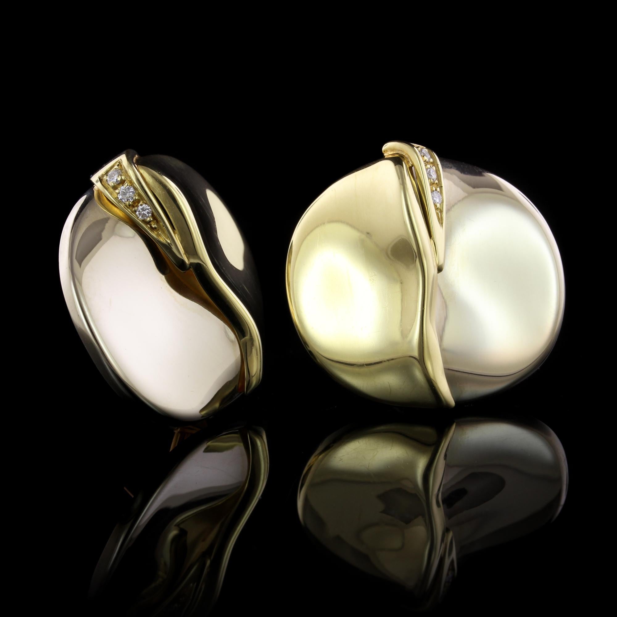 Misani 18K Two-Tone Gold and Diamond Earrings, Italy. The circular earrings are set with six full cut diamonds, approx. total wt. .10cts., FG color, VS clarity.