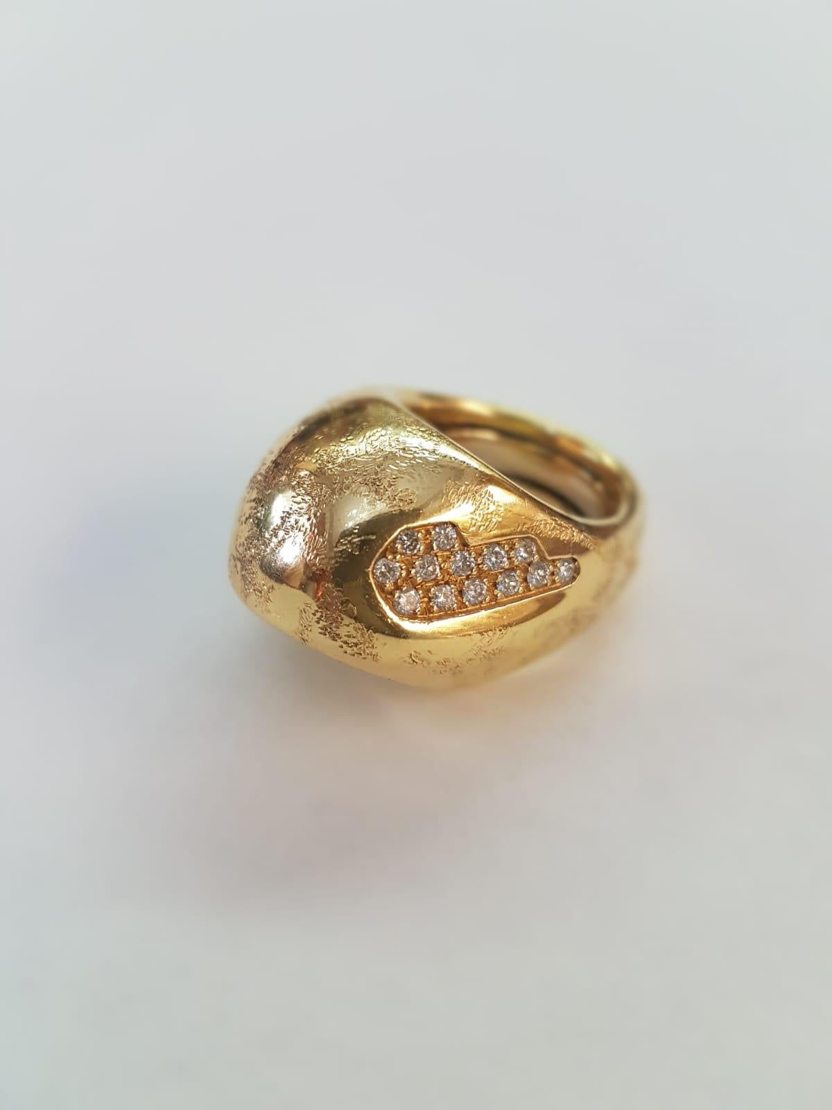 This one of a kind 18 Karat Yellow Gold (satin-finishing) Misani ring with is the result of a complex artistic process, as per every creation from Misani. His ability to enhance the peculiarities of each material and bringing out its natural essence