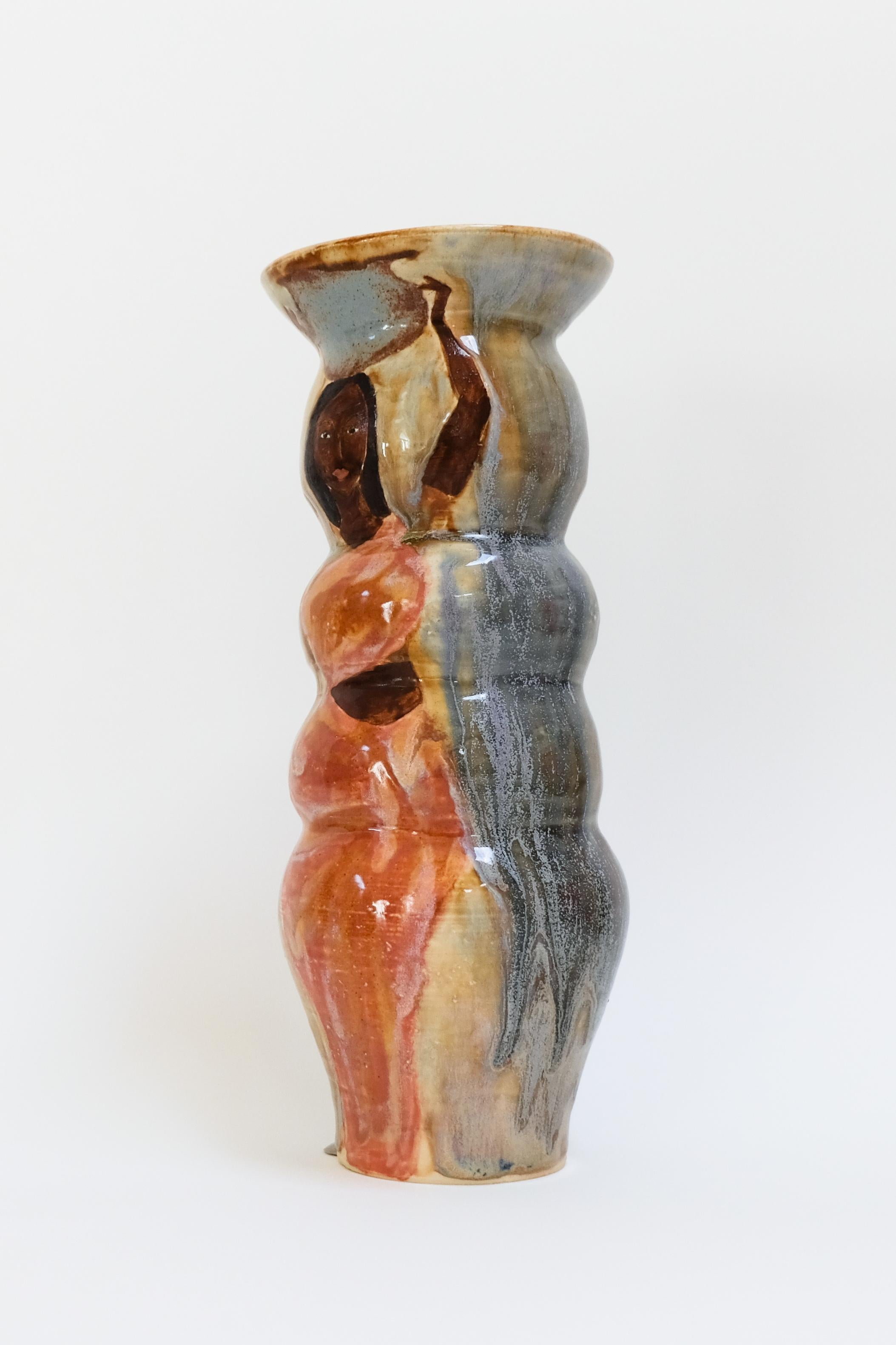 This warm contemporary figurative ceramic vase is an original artwork by Canadian artist Misbah Ahmed. This piece from her collection of Mur vessels explores organic feminine forms with clay. Mur - meaning curve - uses a combination of wheel