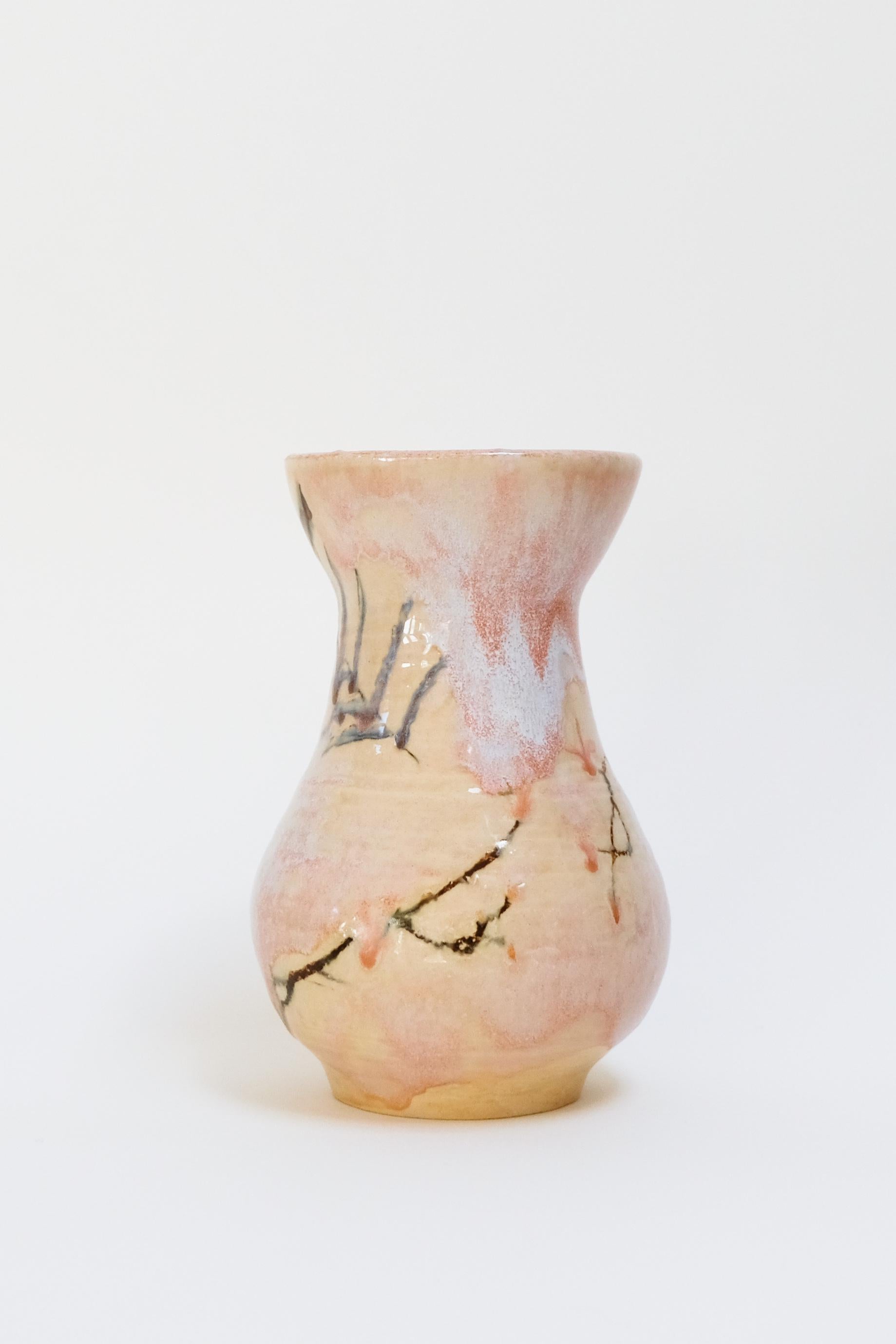 This warm contemporary botanical ceramic vase is an original artwork by Canadian artist Misbah Ahmed. This piece from her collection of Mur vessels explores organic feminine forms with clay. Mur - meaning curve - uses a combination of wheel throwing