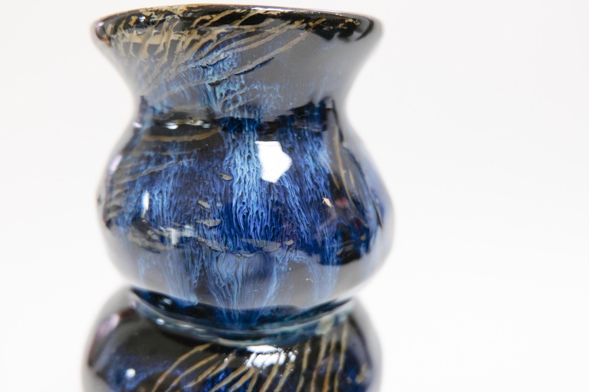 This bold blue contemporary ceramic vase is an original artwork by Canadian artist Misbah Ahmed. This piece from her collection of Mur vessels explores organic feminine forms with clay. Mur - meaning curve - uses a combination of wheel throwing and