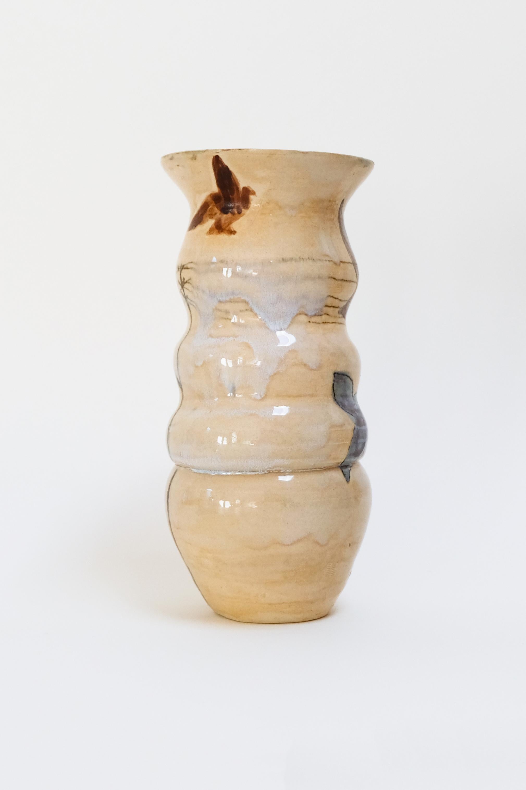 This warm yellow contemporary botanical ceramic vase features a unique bird design and is an original artwork by Canadian artist Misbah Ahmed. This piece from her collection of Mur vessels explores organic feminine forms with clay. Mur - meaning