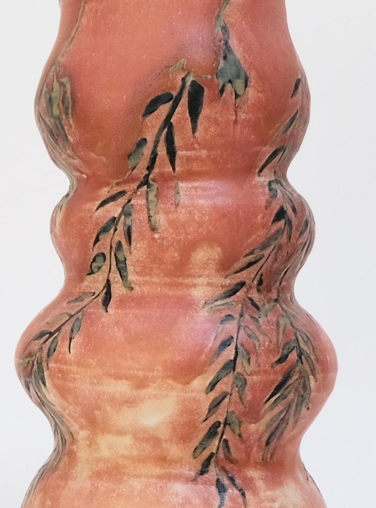 This warm pink contemporary botanical ceramic vase features a unique willow branch design and is an original artwork by Canadian artist Misbah Ahmed. This piece from her collection of Mur vessels explores organic feminine forms with clay. Mur -