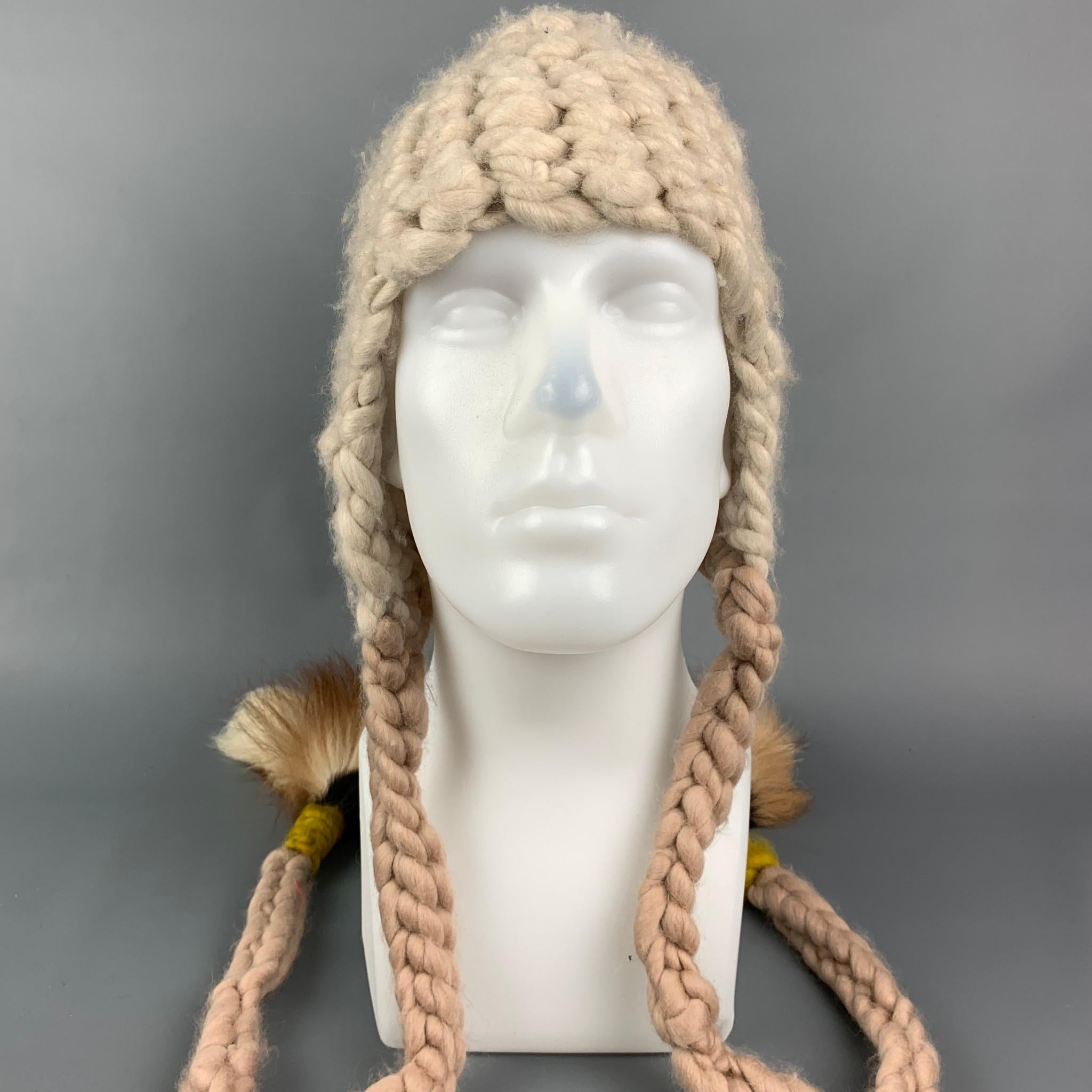 MISCHA LAMPERT hat comes in a cream knitted wool featuring a chunky style and two tail design. Made in USA. 

Very Good Pre-Owned Condition.
Marked: Size tag removed.
Original Retail Price: $260.00

Measurements:

Opening: 20 in.
Height: 10 in. 