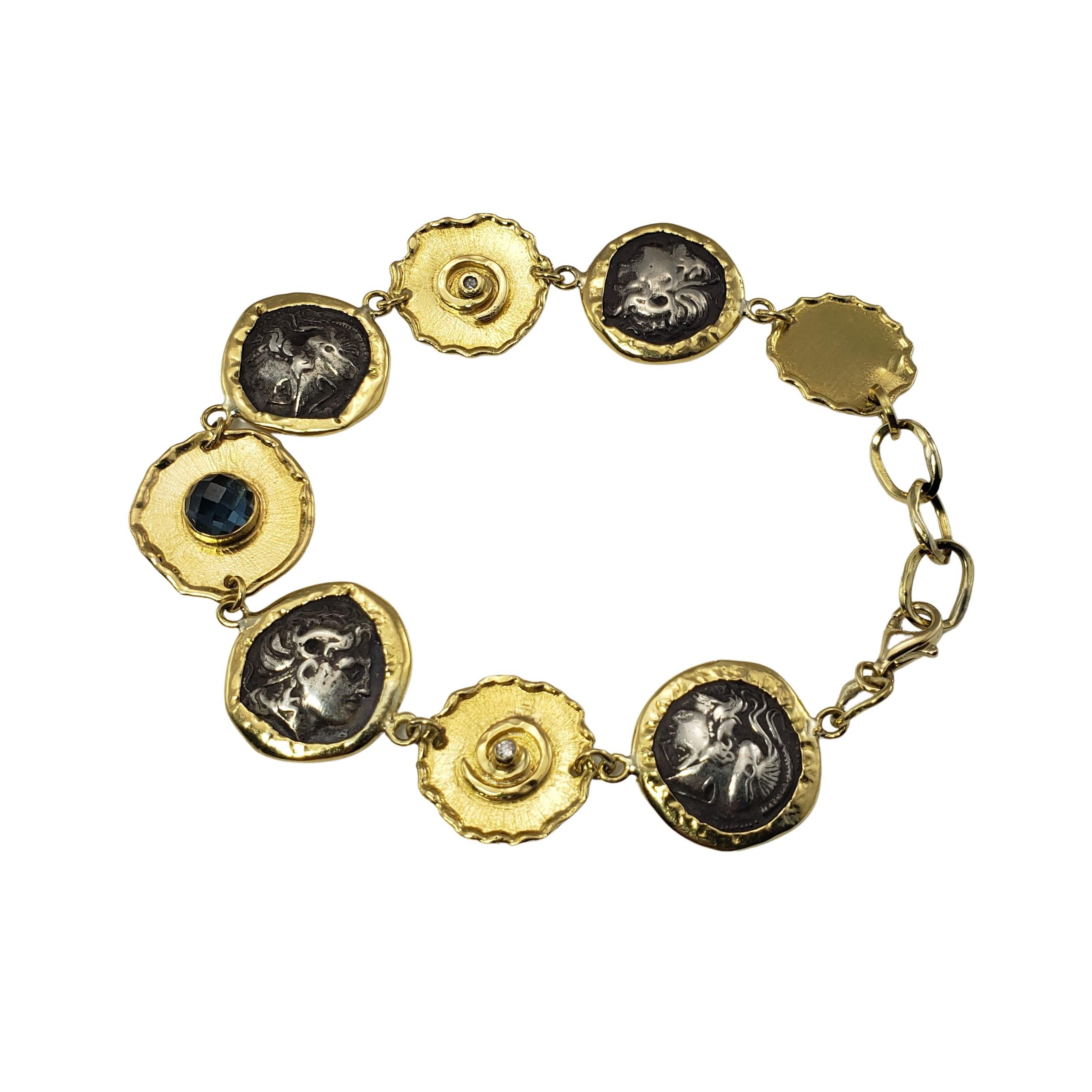 Misento 18 Karat Yellow Blue Gemstone and Diamond Greek Coin Bracelet-

Handmade in Mykonos, Greece by designer Misento, this lovely coin bracelet is crafted in beautifully detailed 18K yellow gold.  Accented with one round faceted blue gemstone (6