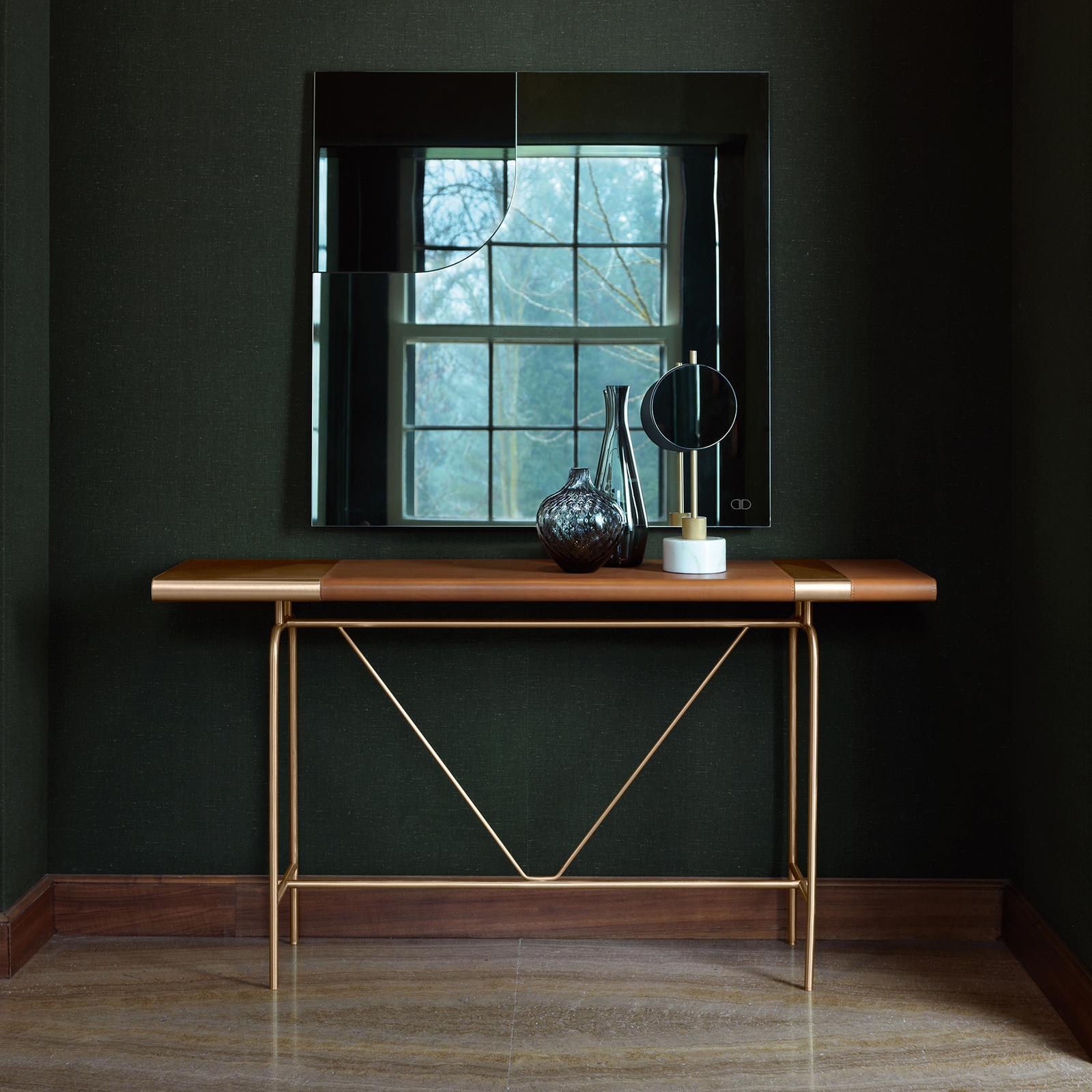Overwhelming, amazing, variable with every breath taking life as a play. Misia console by Daytona is structured with tubular brass frame, plywood top lined with brass and leather lamina. Conceived and designed by the famous designer Leonardo