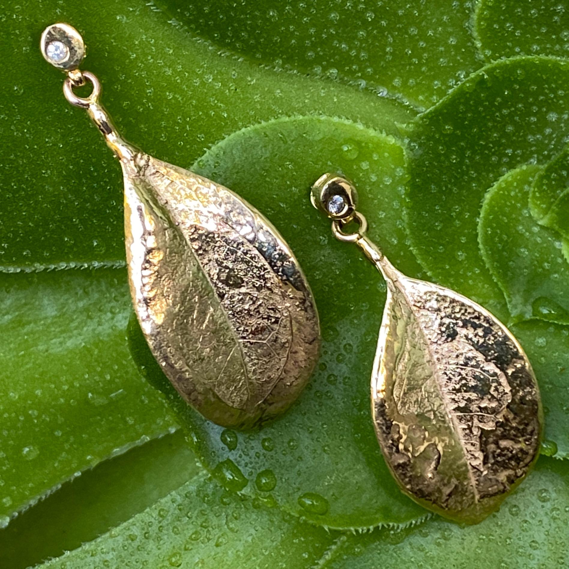 These lightweight, light-loving earrings are cast from actual leaves and, as such, they are whisper thin and bear the same natural texture.  They are 14K yellow gold, but have been flash-dipped in 18 karat gold, which gives them uneven splashes of
