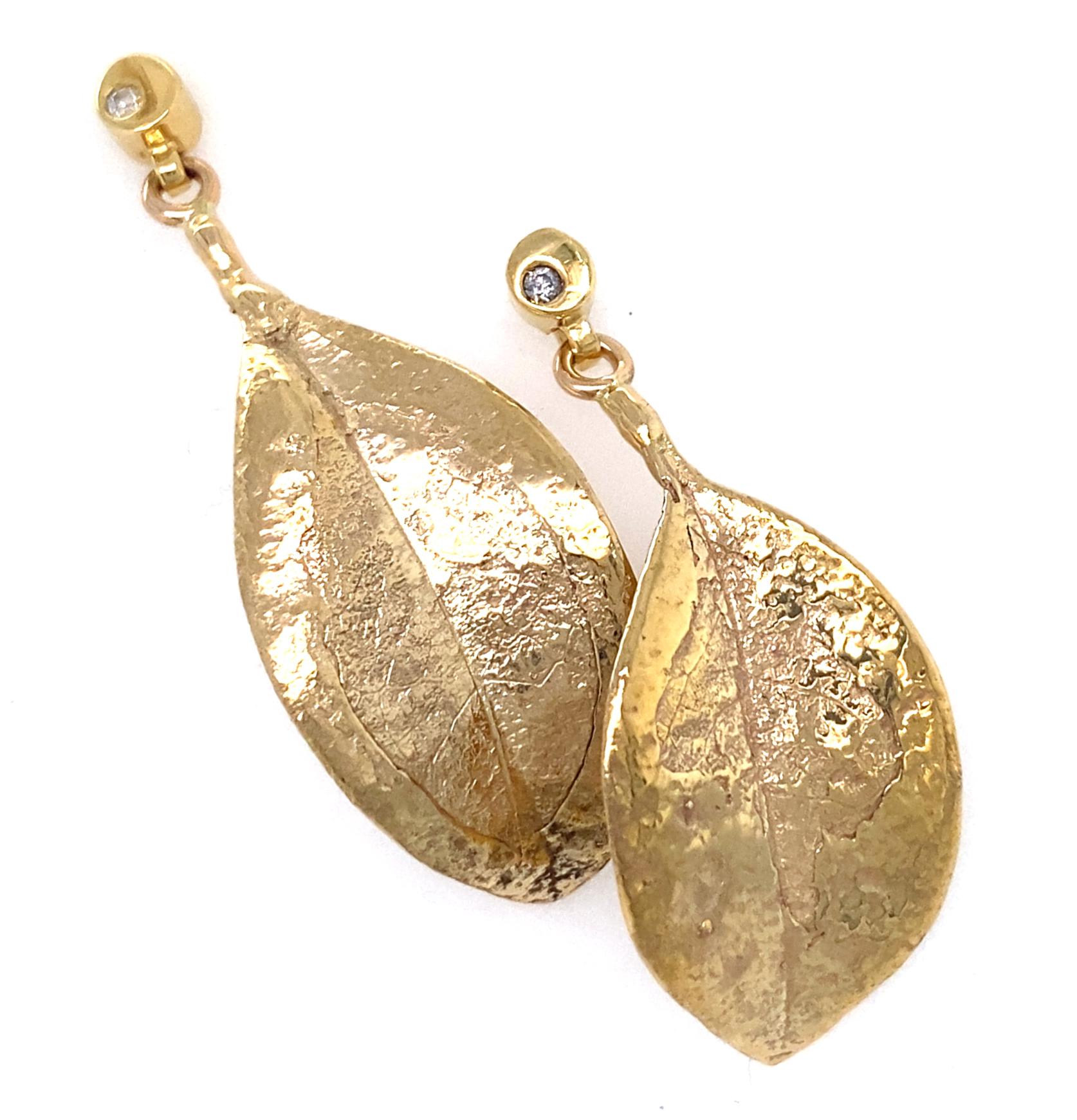 Contemporary Mismatched Leaf Dangle Earrings in Yellow Gold with Diamond Accents For Sale
