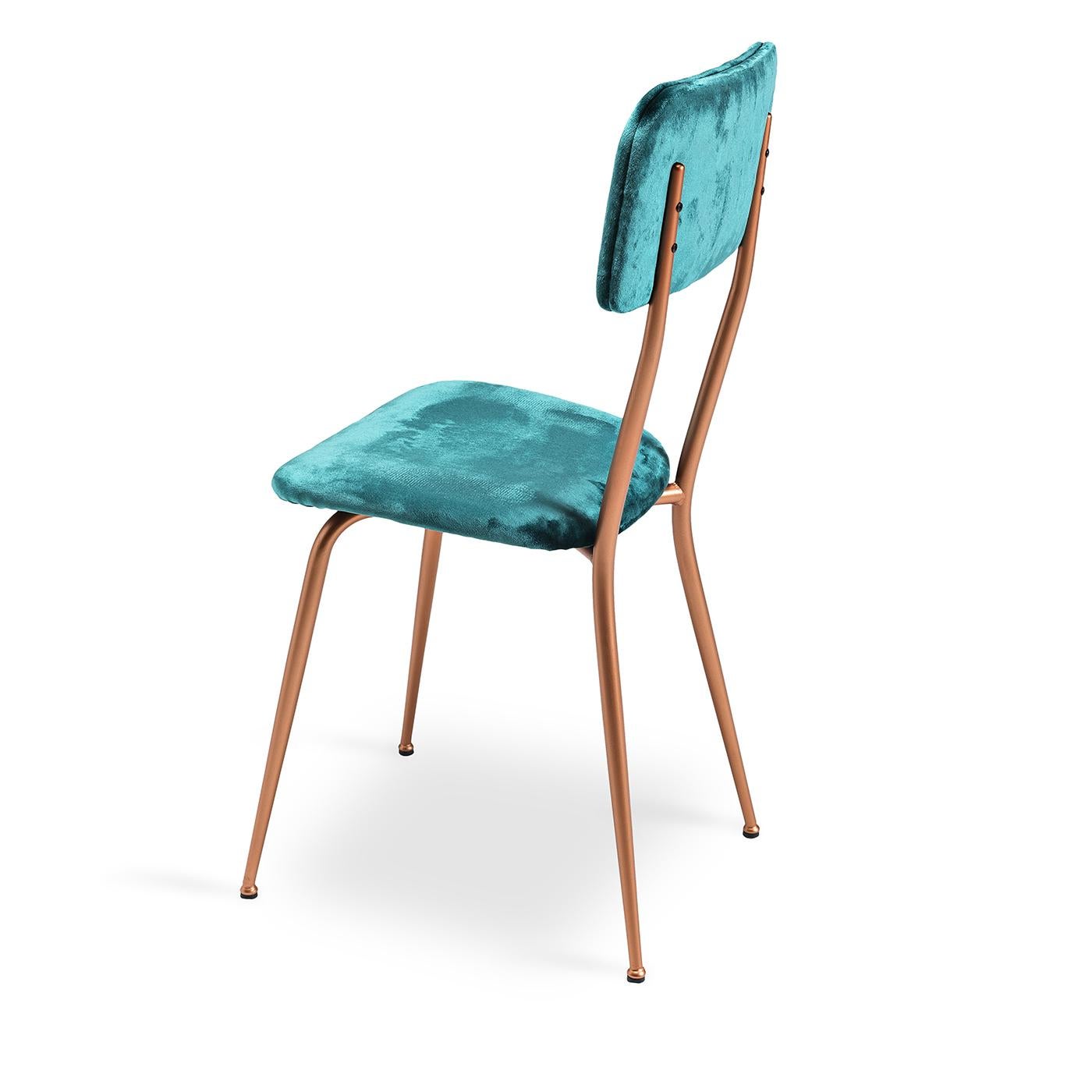 The Miss Ava 4 chair updates a classic silhouette with an ultra-stylish combination of tones and textures. Its understated metal frame boasts a brushed copper finish for a decidedly modern look. Upholstered in luxurious teal velvet, this chair's