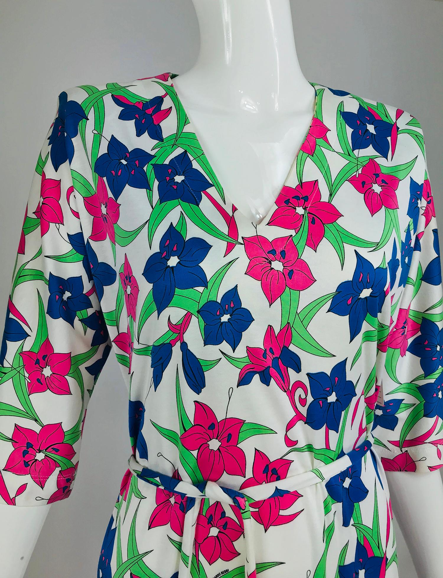 Miss Bessi Floral Fine Cotton Lisle Knit Day Dress 1990s. Simple shift dress in luxurious, lustrous cotton Lisle knit. The print is vivid with lillies in marine blue, grass green and bright pink on a white ground. V neck dress has 3/4 length raglan