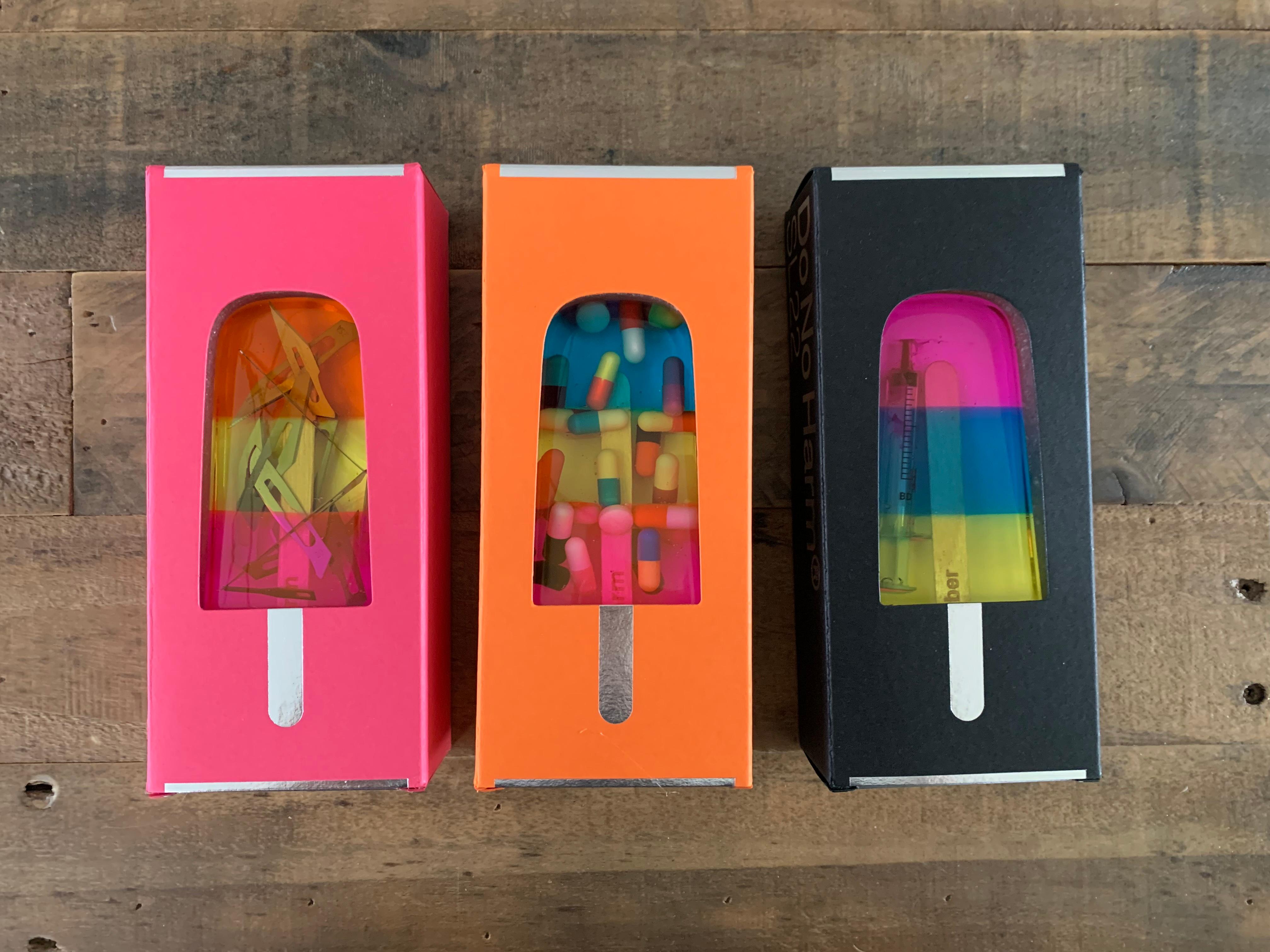 Set of 3 Handmade Resin Ice Lolly with various accruements such as a used Syringe, pills, and razor blades
Each Presented in a Custom Box.
2021
Unnumbered series of lollies. Each come with a Certificate of Authenticity.
We believe this would look