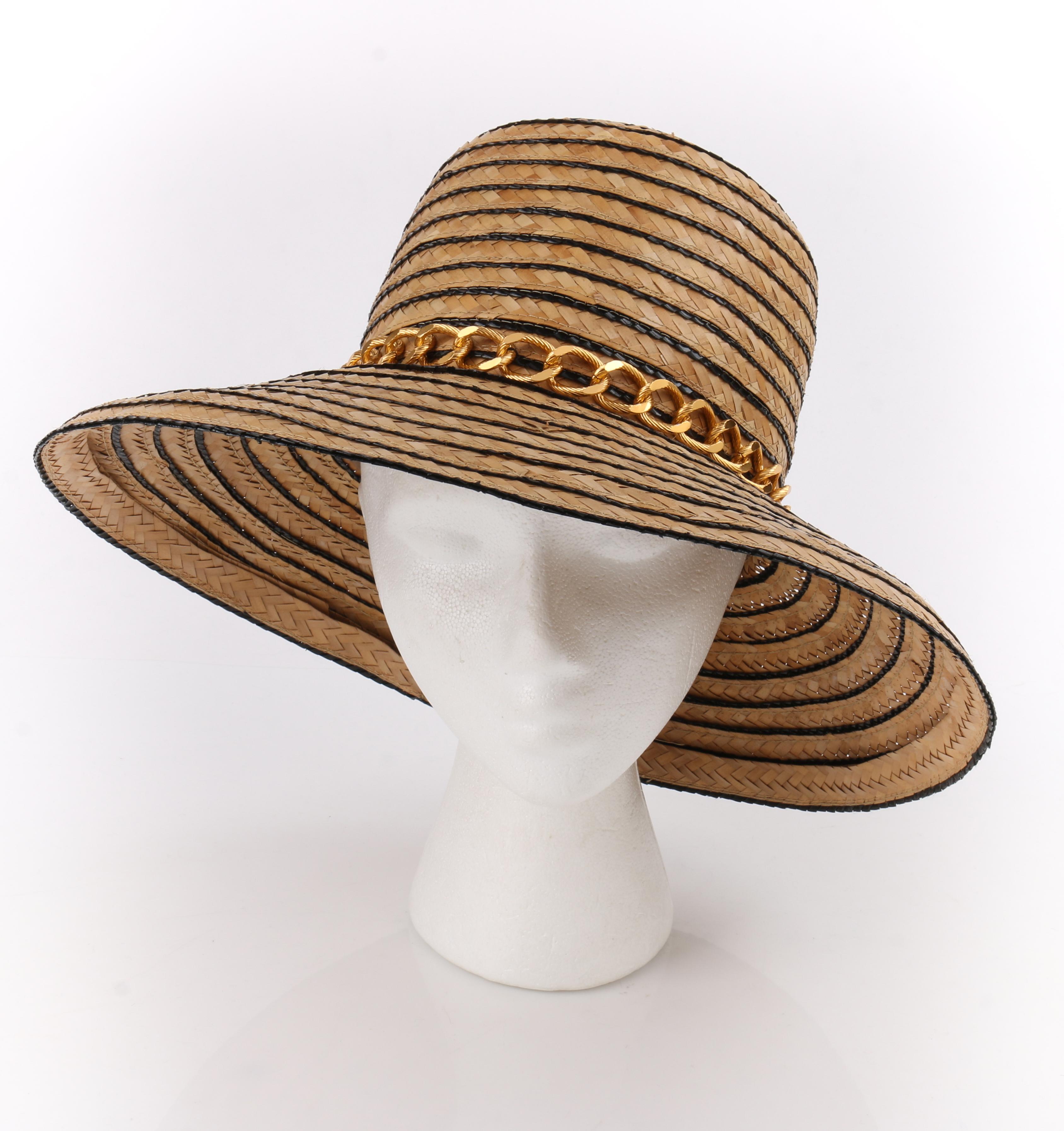 Miss Dior by CHRISTIAN DIOR c.1960’s Black Gold Woven Straw Bow Chain Sun Hat (New-Old Stock)
 
Circa: 1960’s
Label(s): Miss Dior created by Christian Dior / Saks Fifth Avenue
Style: Face framer / Sun hat 
Color(s): Shades of natural, black and gold