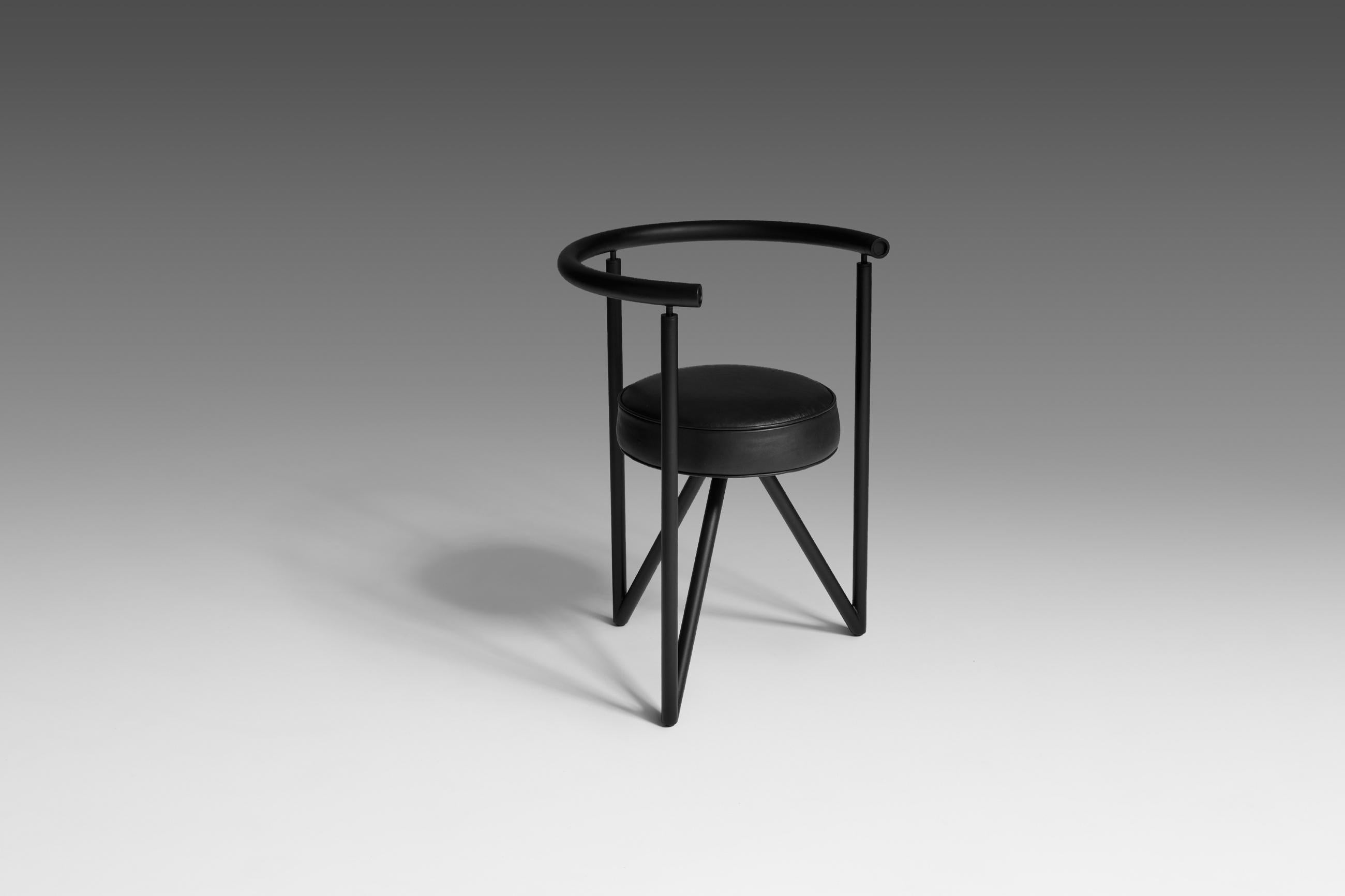 ‘Miss Dorn’ side chair by Philippe Starck for Disform, 1982. Constructed out of a black coated steel tubular frame and a round black leather seat. The primary shapes used for the design are giving the chair an interesting and sculptural appearance.