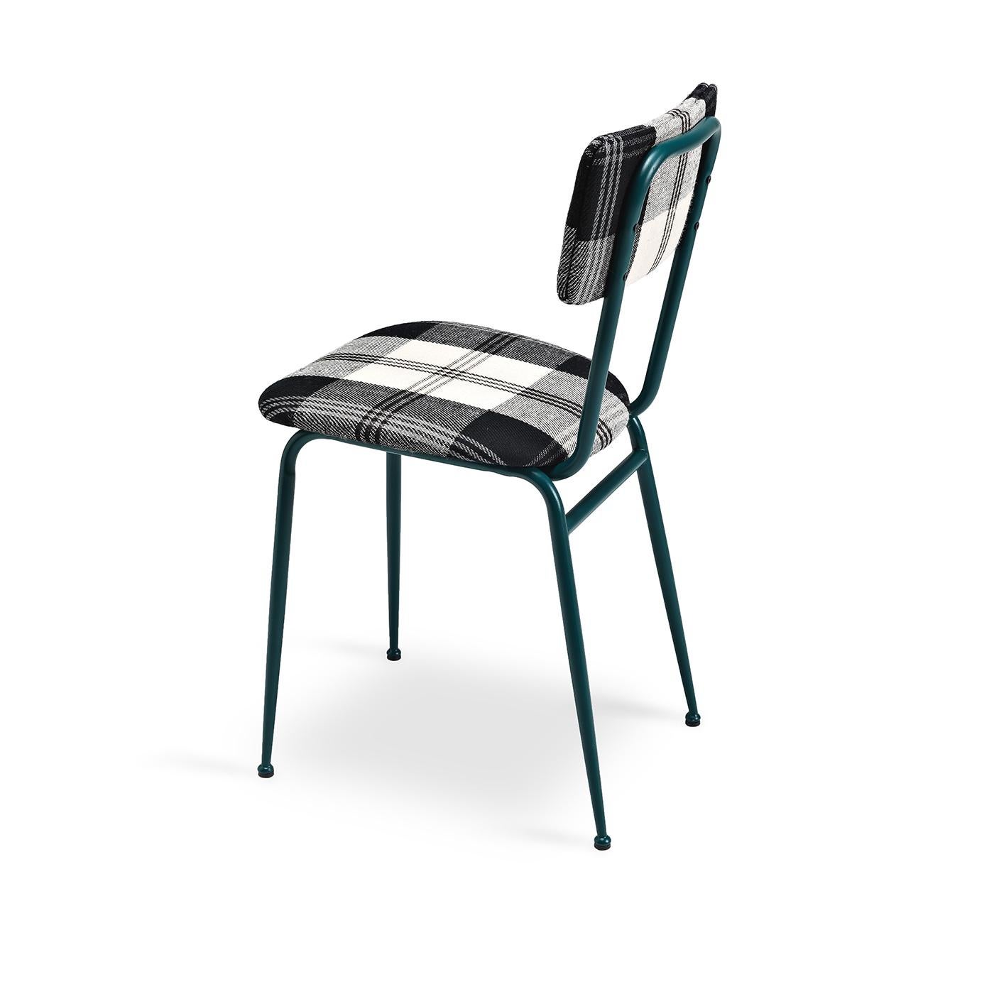 This hip, vintage dining chair has a sleek metal frame that is painted in a matte green finish. The seat and back are comfortable and structured thanks to polyurethane and curved wood inserts, are both are upholstered in a non-removable, large-print