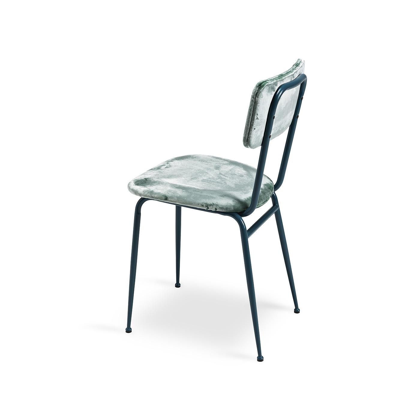 The Miss Gina 3 chair boasts a sleek metal frame with a matt avio blue lacquered finish. Upholstered in turquoise velvet for a streamlined yet statement aesthetic, its padded seat and backrest offer optimal comfort. The perfect way to add an instant