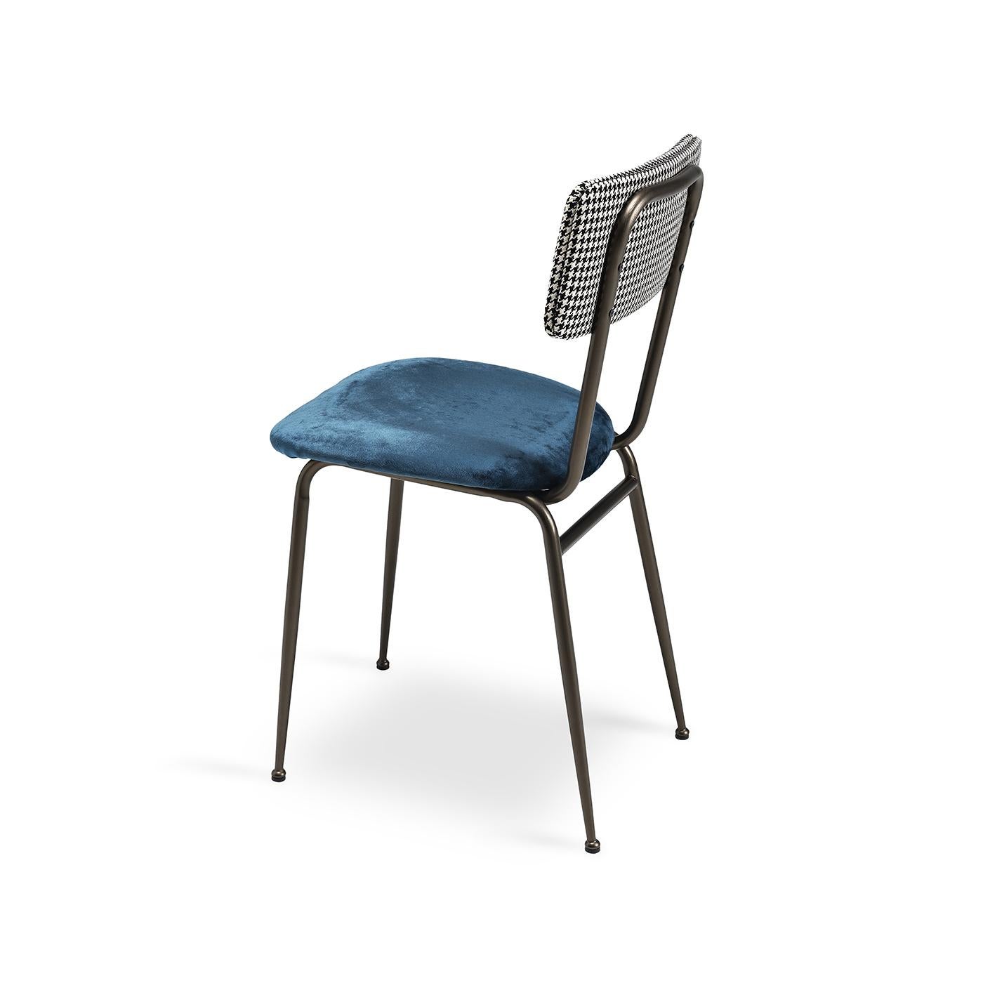 This dining chair will add vintage charm to any dining setting. This piece has a streamlined metal frame with a brushed bronze metallic finish. The seat is upholstered in non-removable dark blue velvet, while the back is covered in a non-removable