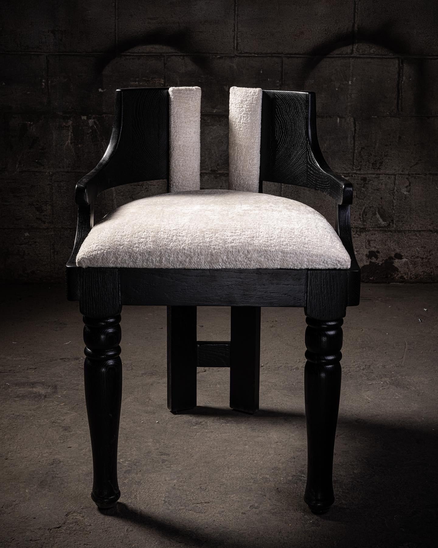 Upholstered black oak dining chair.