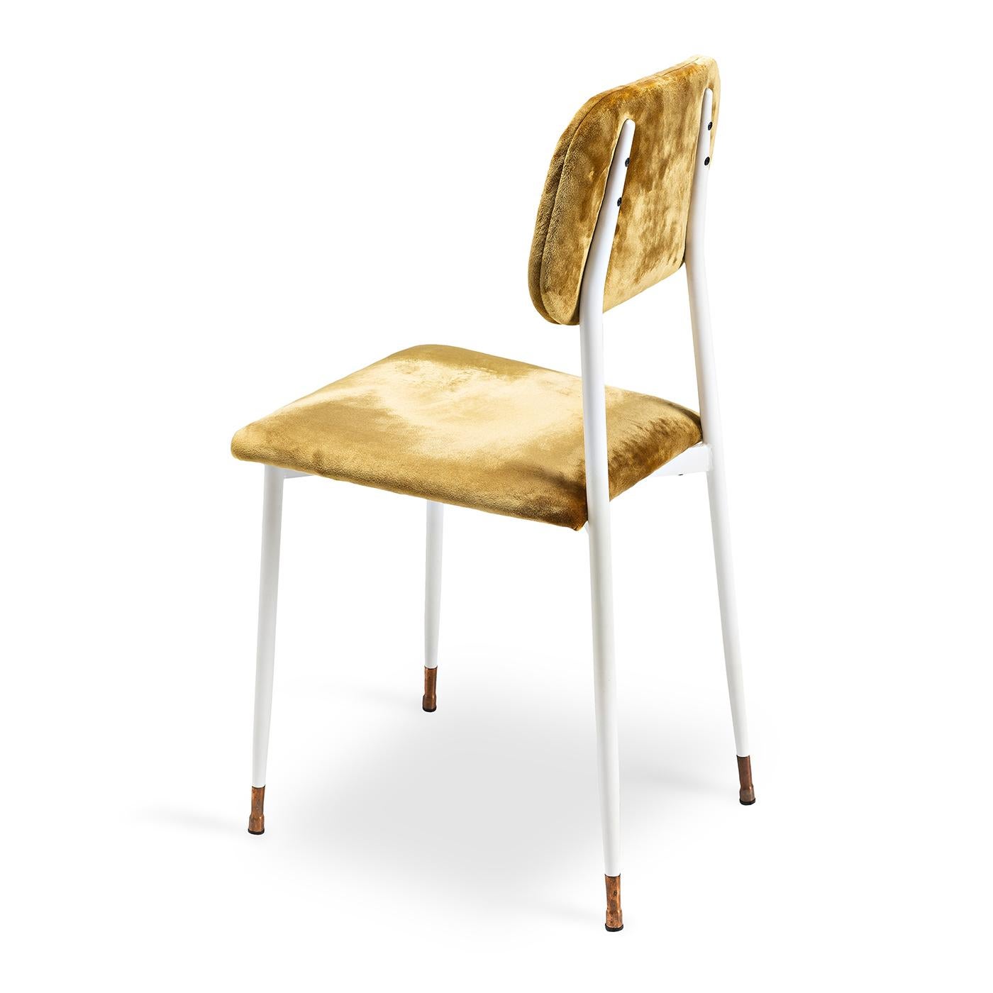 Classy, simple and a bit vintage, this dining chair has a simple metal frame and legs that are finished in a snow-white matte paint, while the bottoms of the legs are decorated with brass chair guides. Its back and seat, structured with polyurethane
