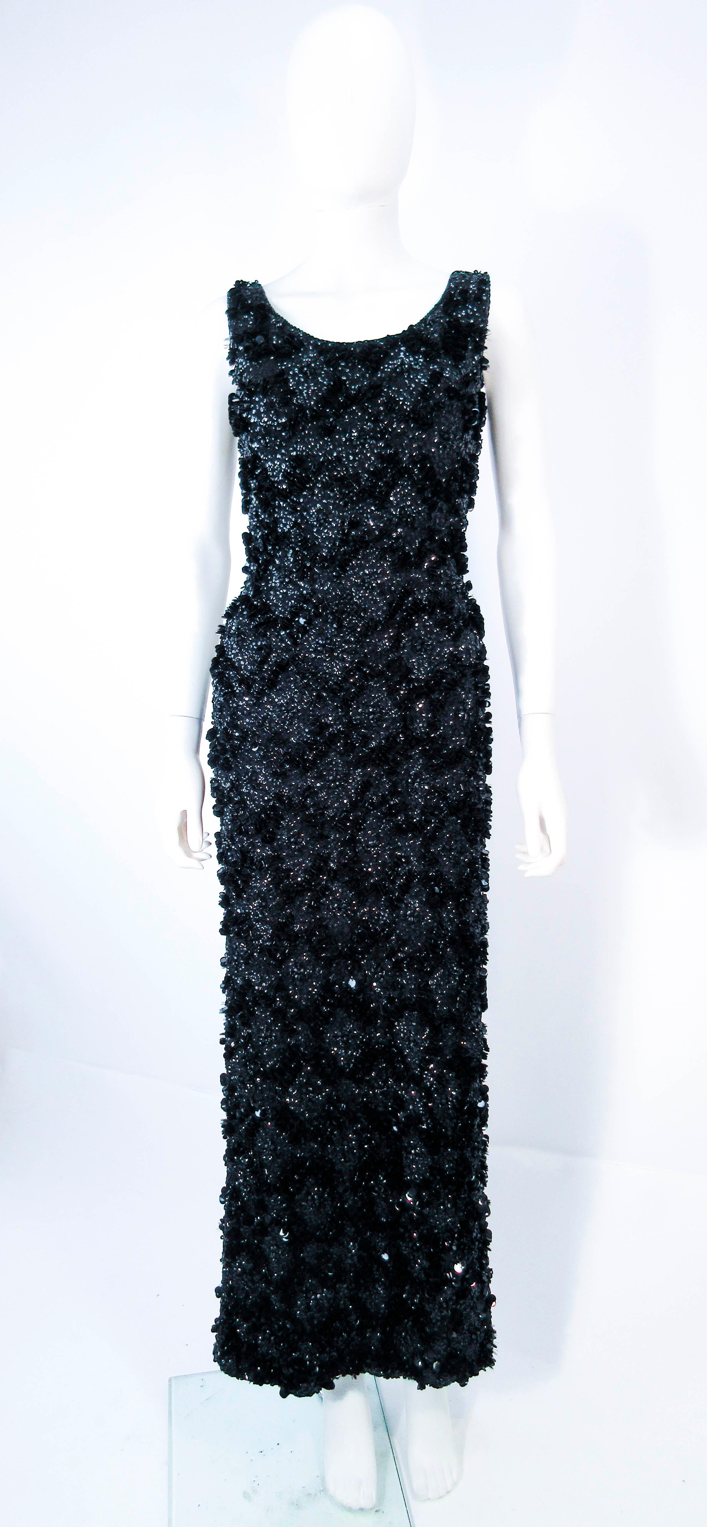 This Miss Ruth design is composed of a relief beaded & sequin black wool. Features a center back zipper closure, with scoop back style. Please feel free to ask us any additional questions you may have. 

 Measurements
Length: 58