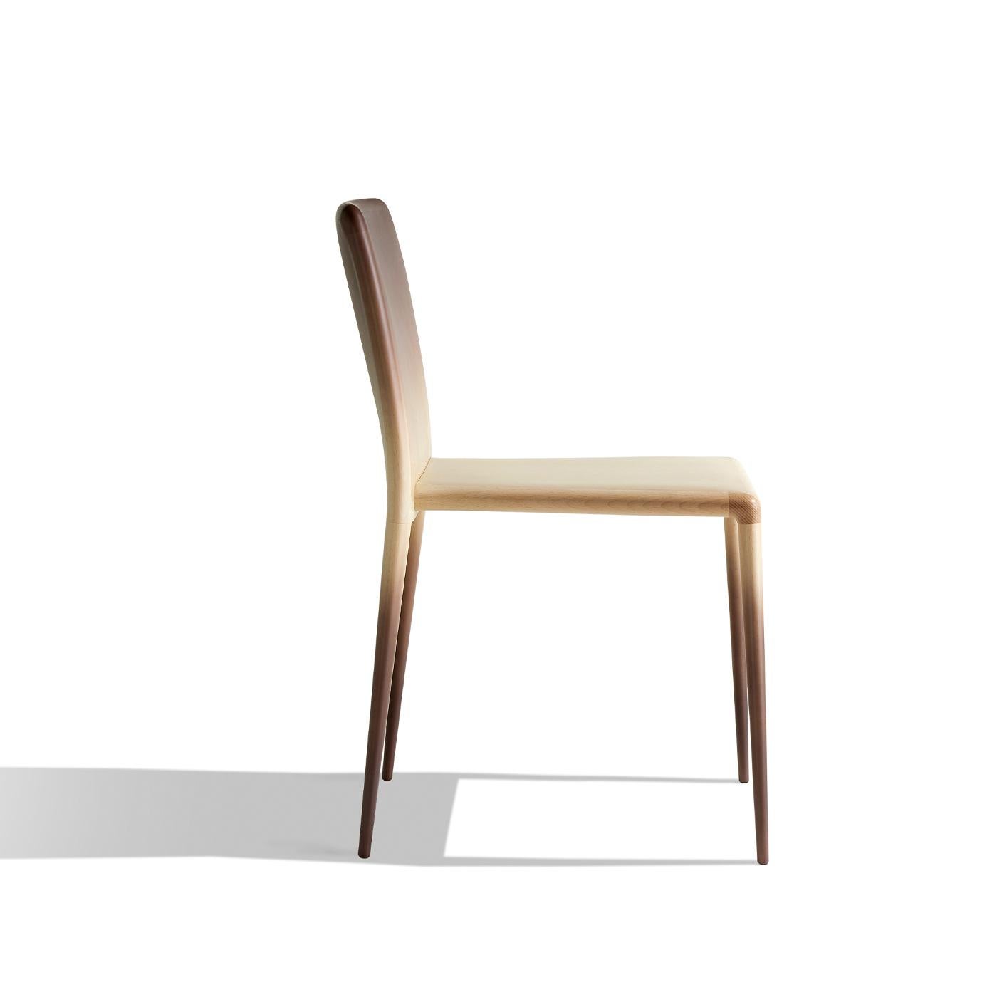 Elegance in its purest form, this chair combines airy and sturdy qualities in a perfectly clean-lined wooden silhouette that recreates the delicate flair of refined fabrics. Crafted of solid beech following highly technological procedures, it is