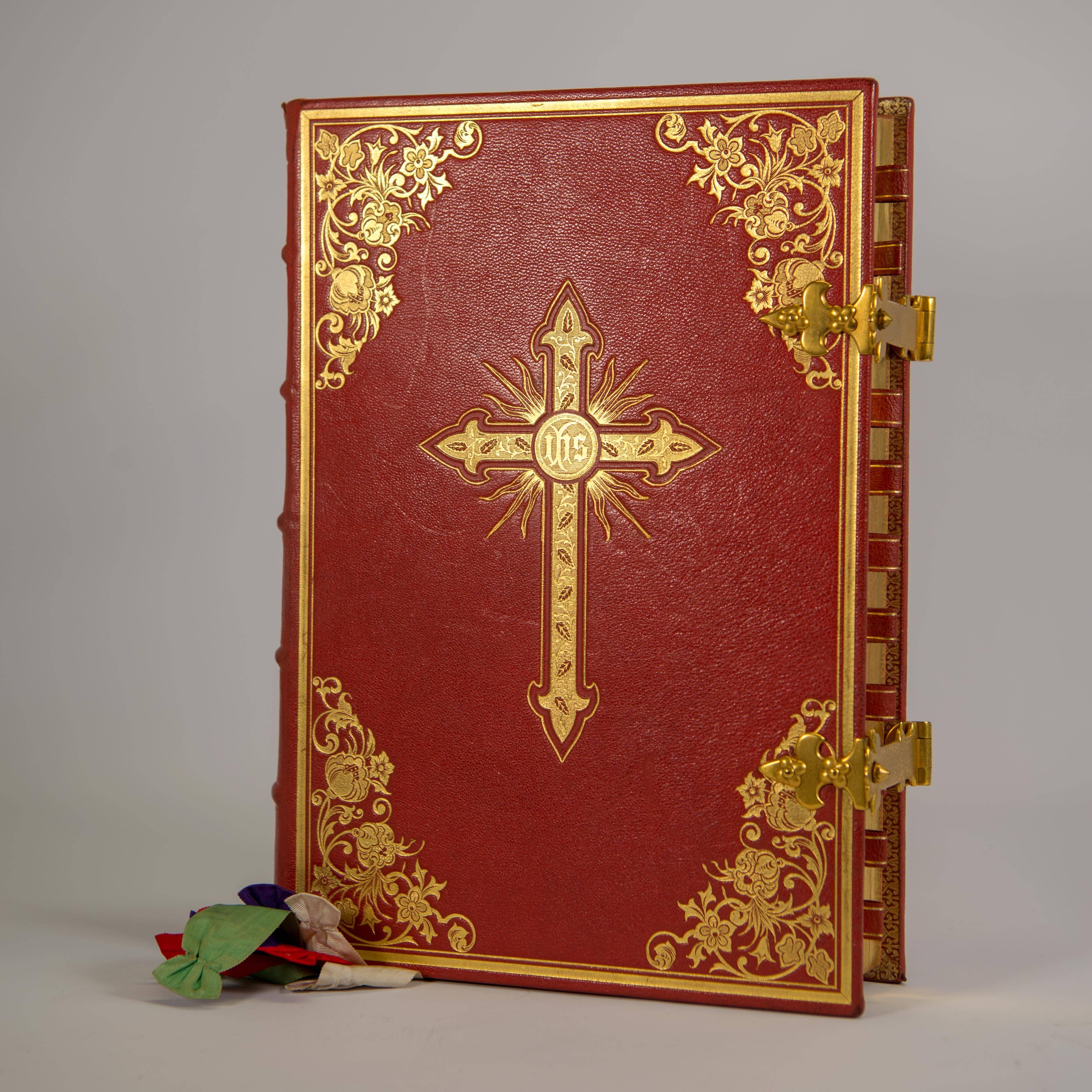 Latin liturgical book containing all instructions and texts necessary for the celebration of Mass throughout the year. The book has a gold-leaf cross and emblems on the front and back. Multiple songs and images printed on the inside. 

Book is in