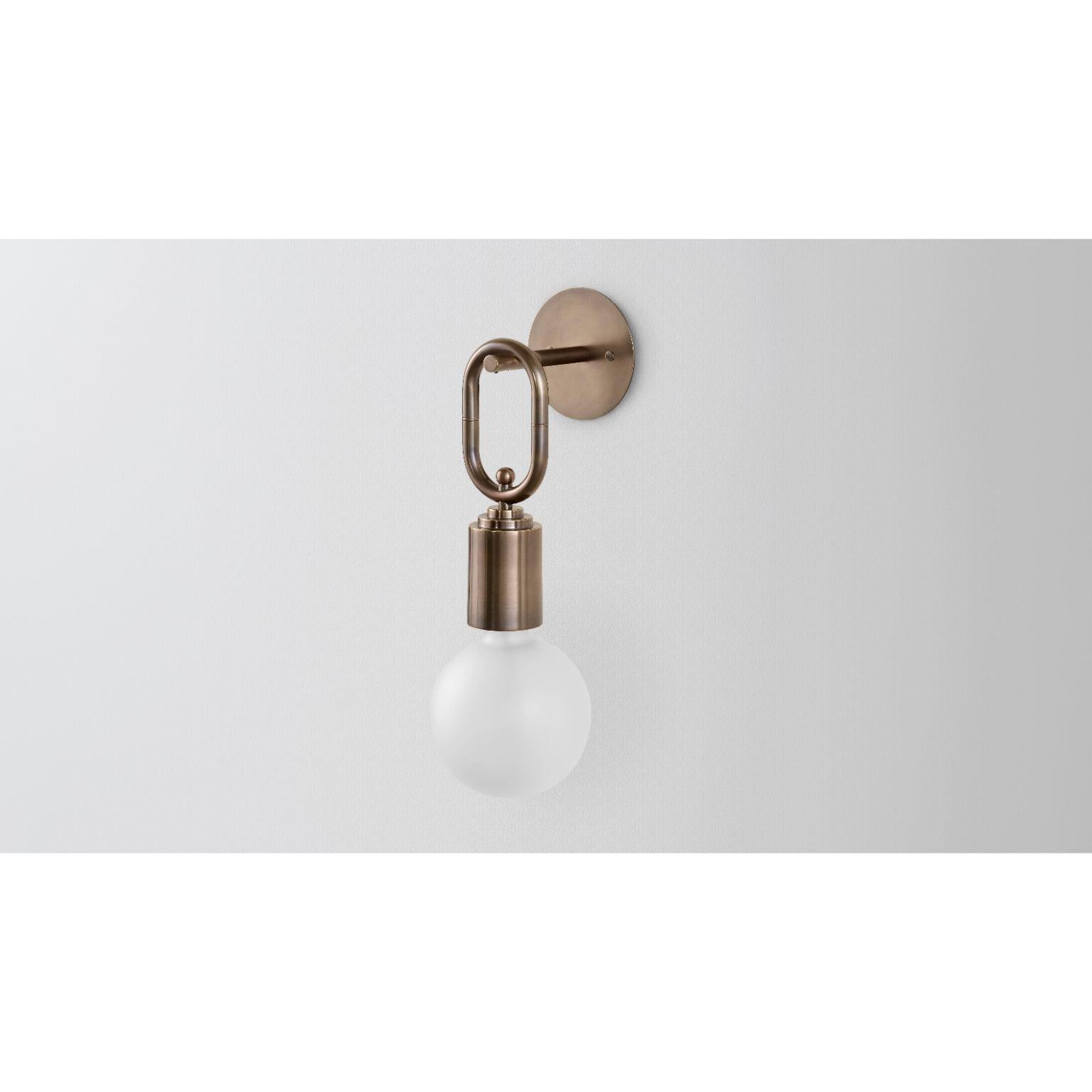 Missing link by Volker Haug
Dimensions: 24 x h 46 cm
Materials: Polished or bronzed brass
Finish: Raw, satin lacquer or enamel
Weight: approx 1kg

Lamp: 240V E27 with Ø 150mm frosted lamp
Custom finishes available on request.

The U Chain series