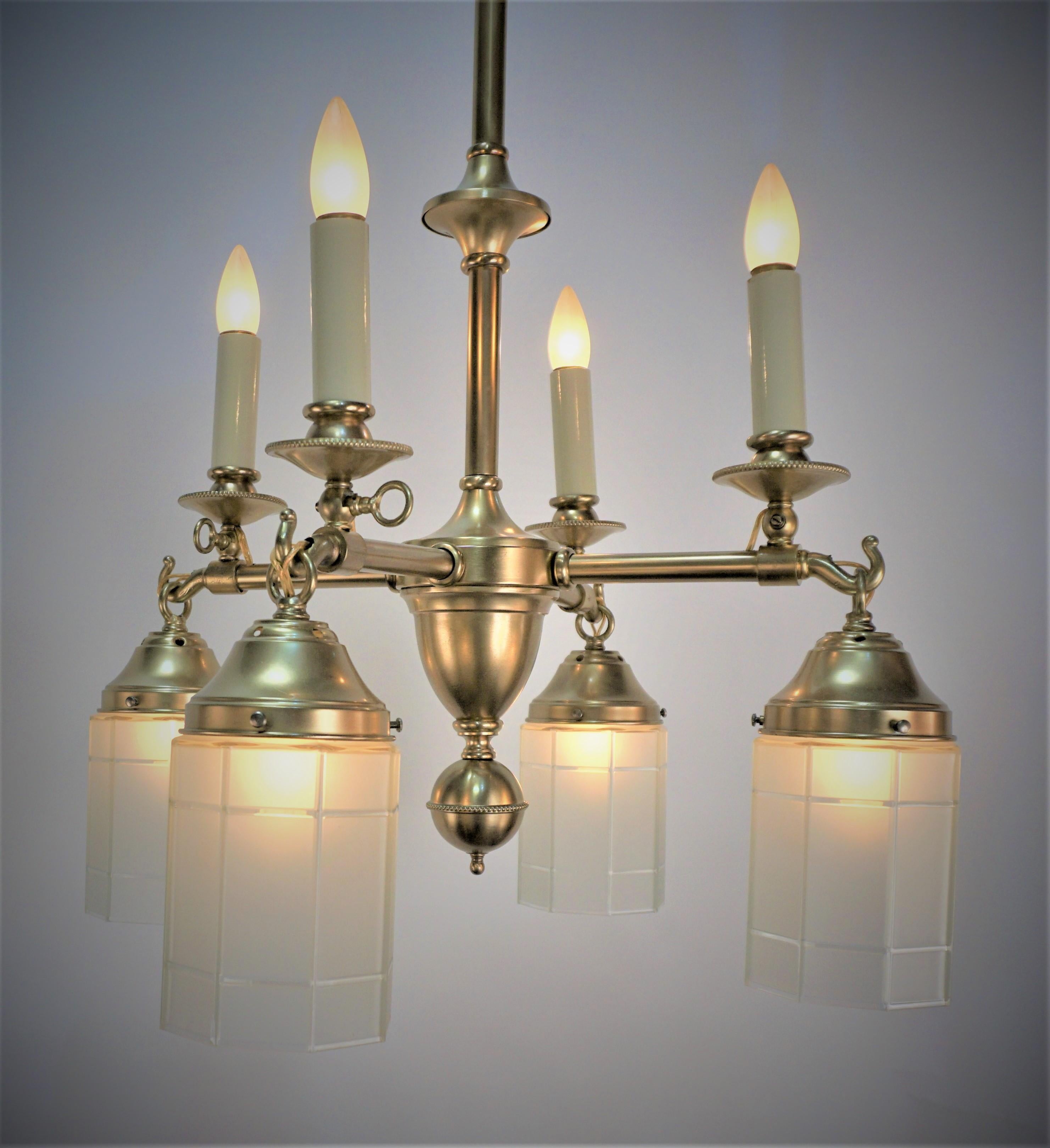 Mission, Arts & crafts early 20th century American four gas and four electrical brass chandelier.
Professionally rewired and ready for installation.