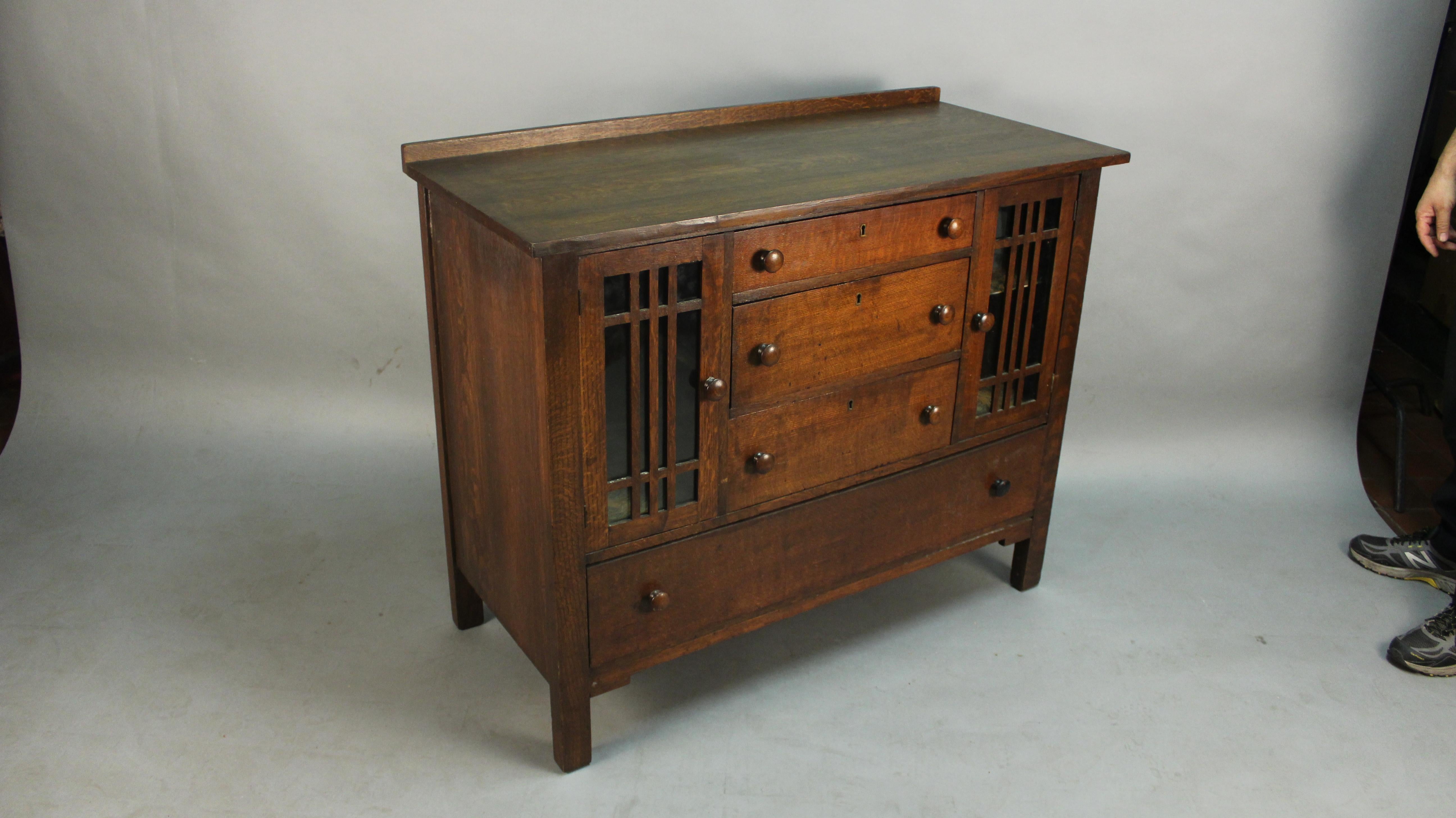 Oak sideboard with classic mission lines, circa 1910. Lots of storage.