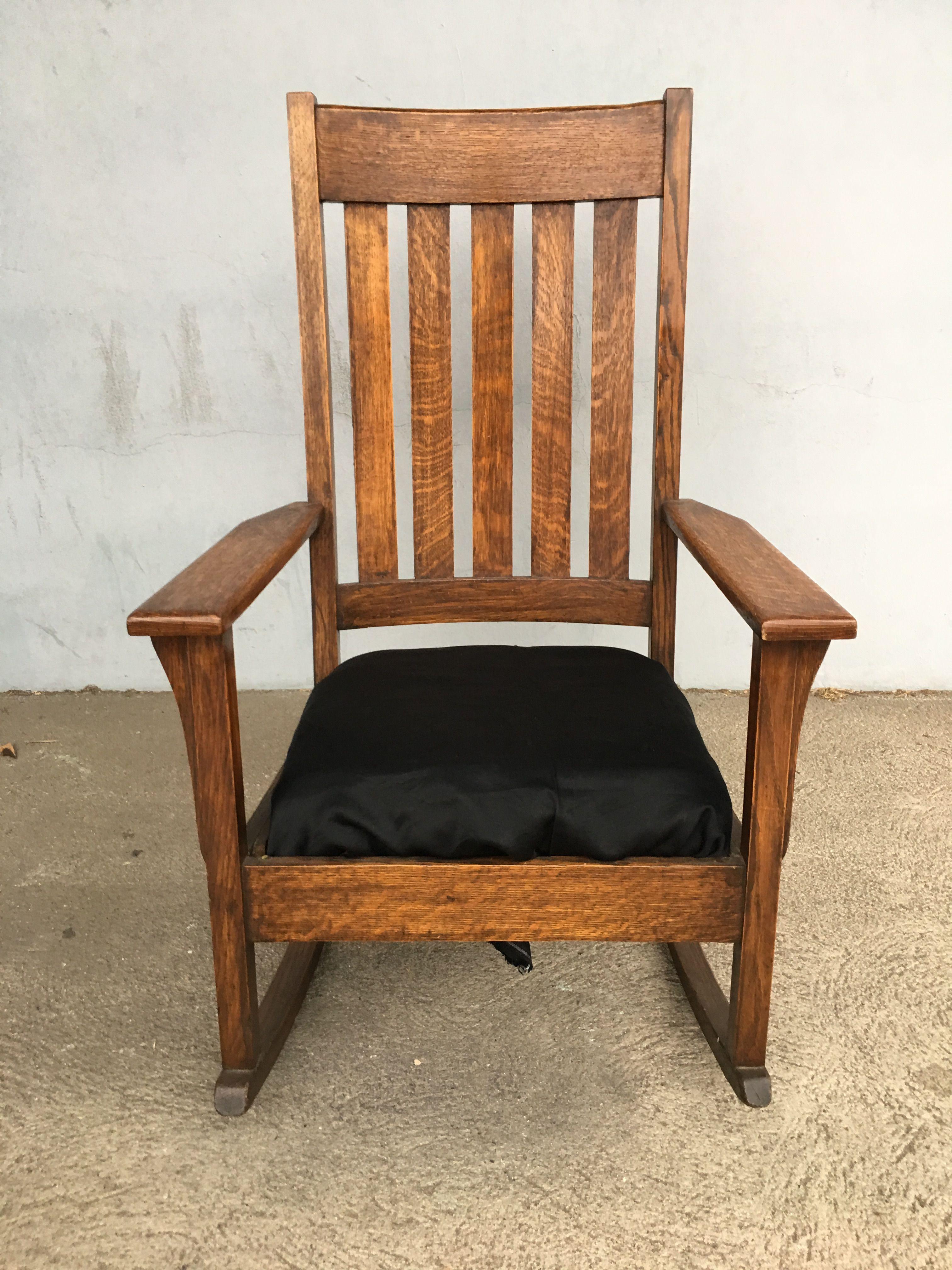 Vintage Chestnut Mission style slat back rocking chair with black leather seat by National Chair Co., circa 1910.