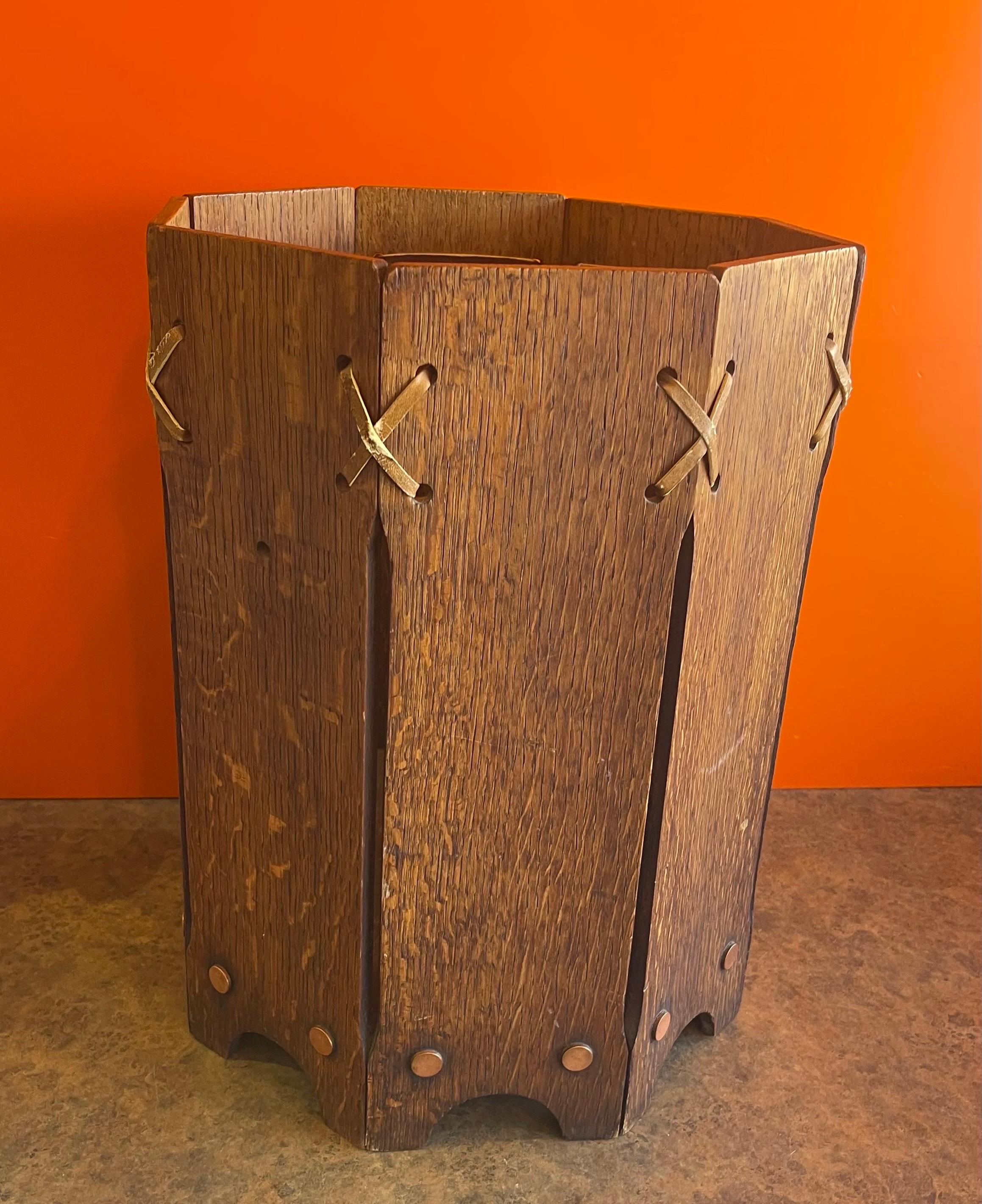 A very well constructed mission / craftsman style American quarter sawn oak waste basket, circa 1940s. The waste basket is in good condition and measures 11.5