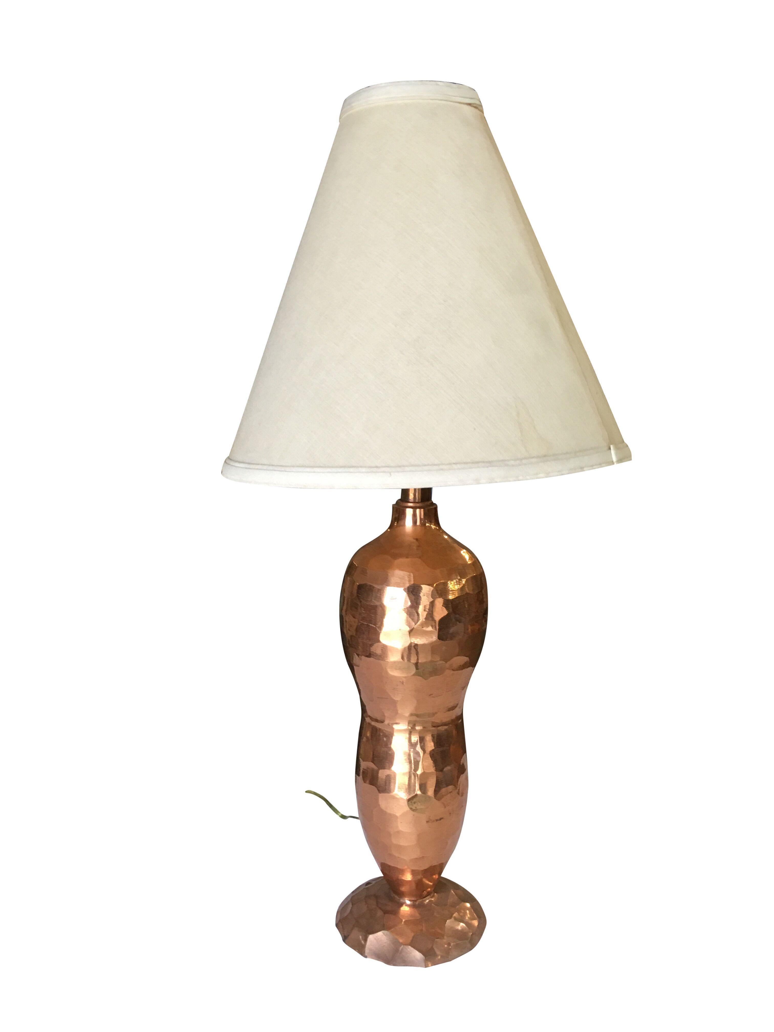 Mission inspired hand-hammered copper lamp pair. The set features two lamps, hand-hammered copper, bottle-shaped lamps with a single light on top.