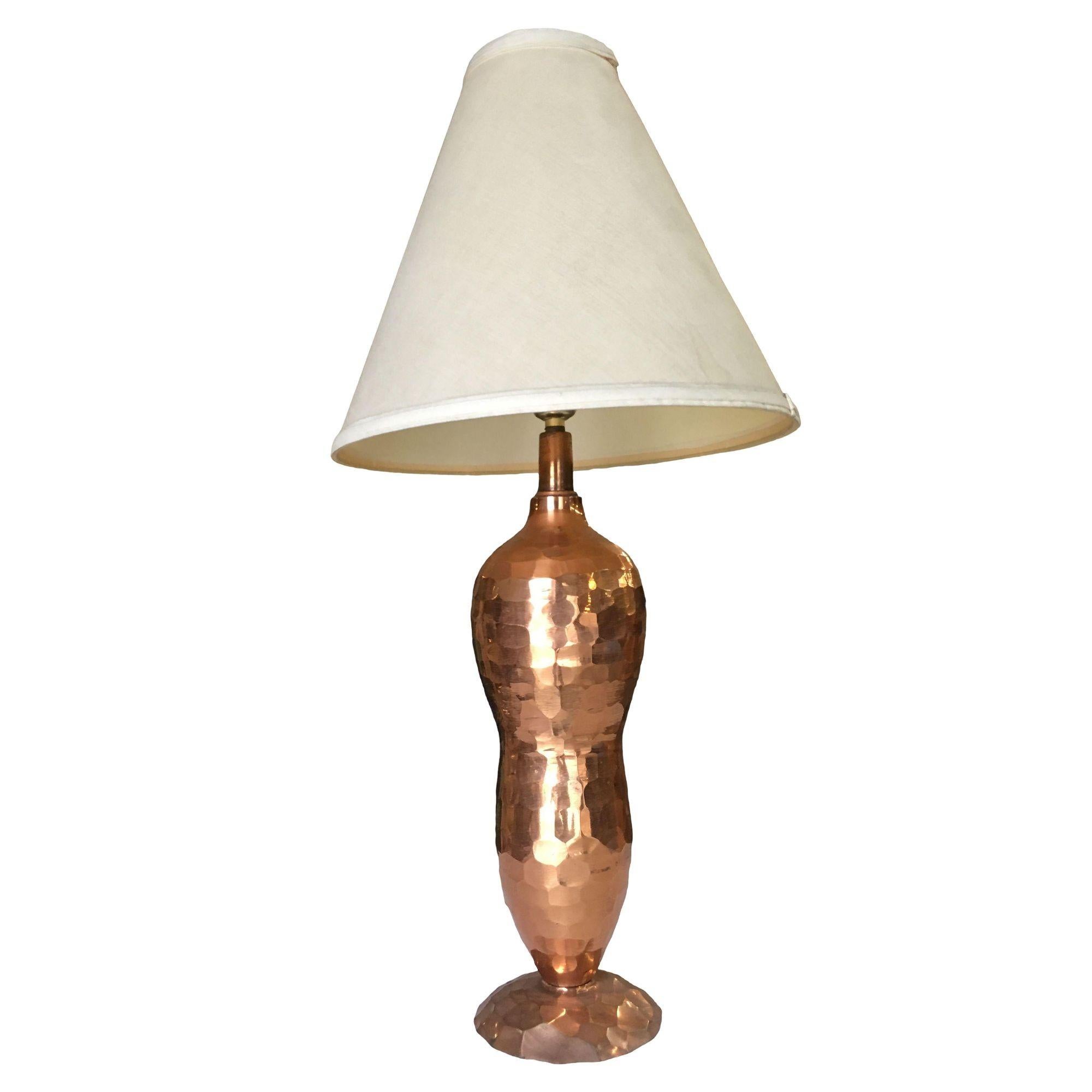 Mission Inspired Hand Hammered Copper Lamp pair. The set features two lamps, hand-hammered copper, bottle-shaped lamps with a single light on top.

--Lamp Shades not included--

Dimensions: Height: 19.5 in, Diameter: 5 in

United States, 1970