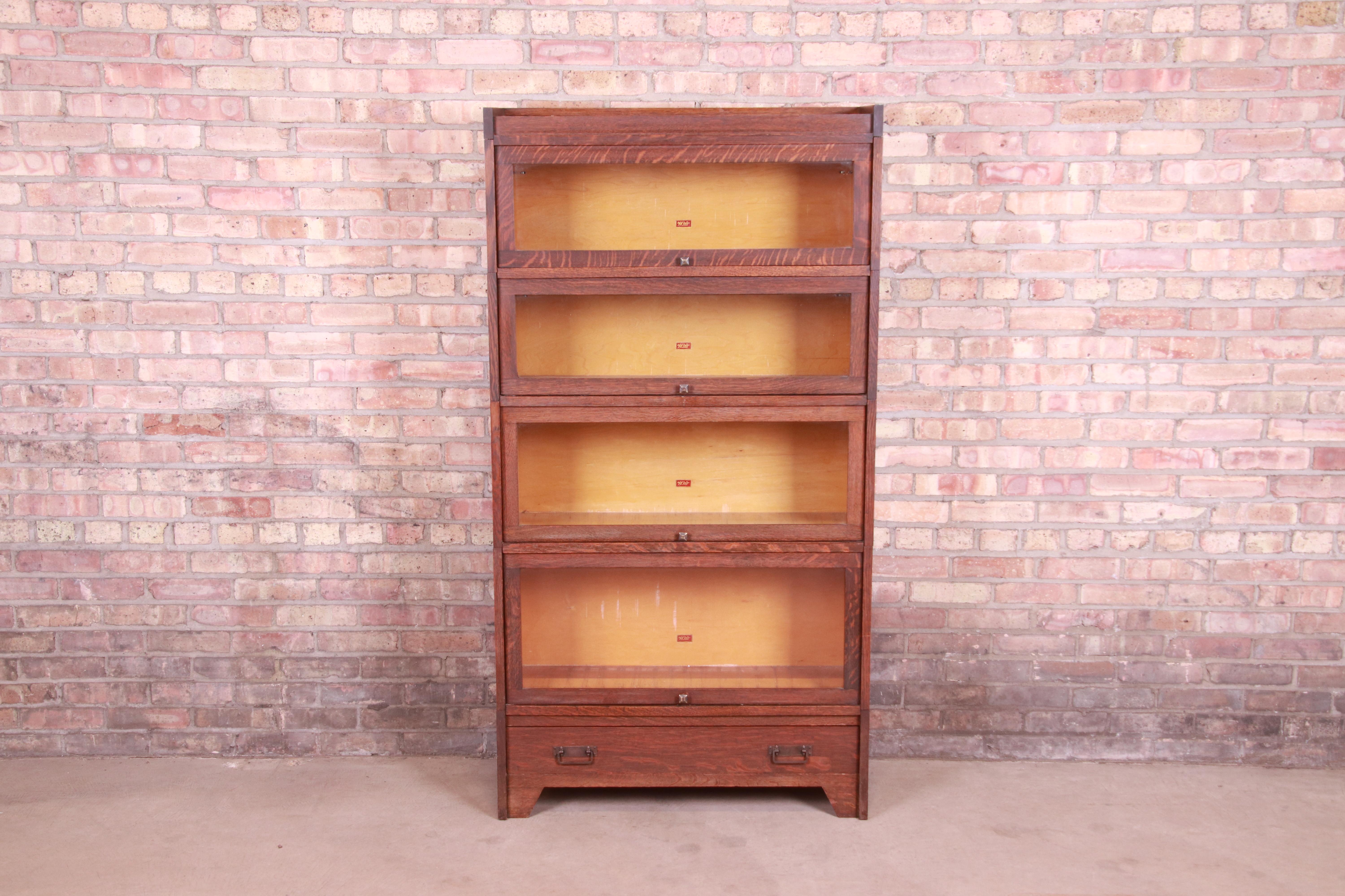 A gorgeous antique Mission oak Arts & Crafts four-stack barrister bookcase

By Weis

USA, Circa 1900

Quartersawn oak, with glass front doors and original brass hardware.

Measures: 34.13