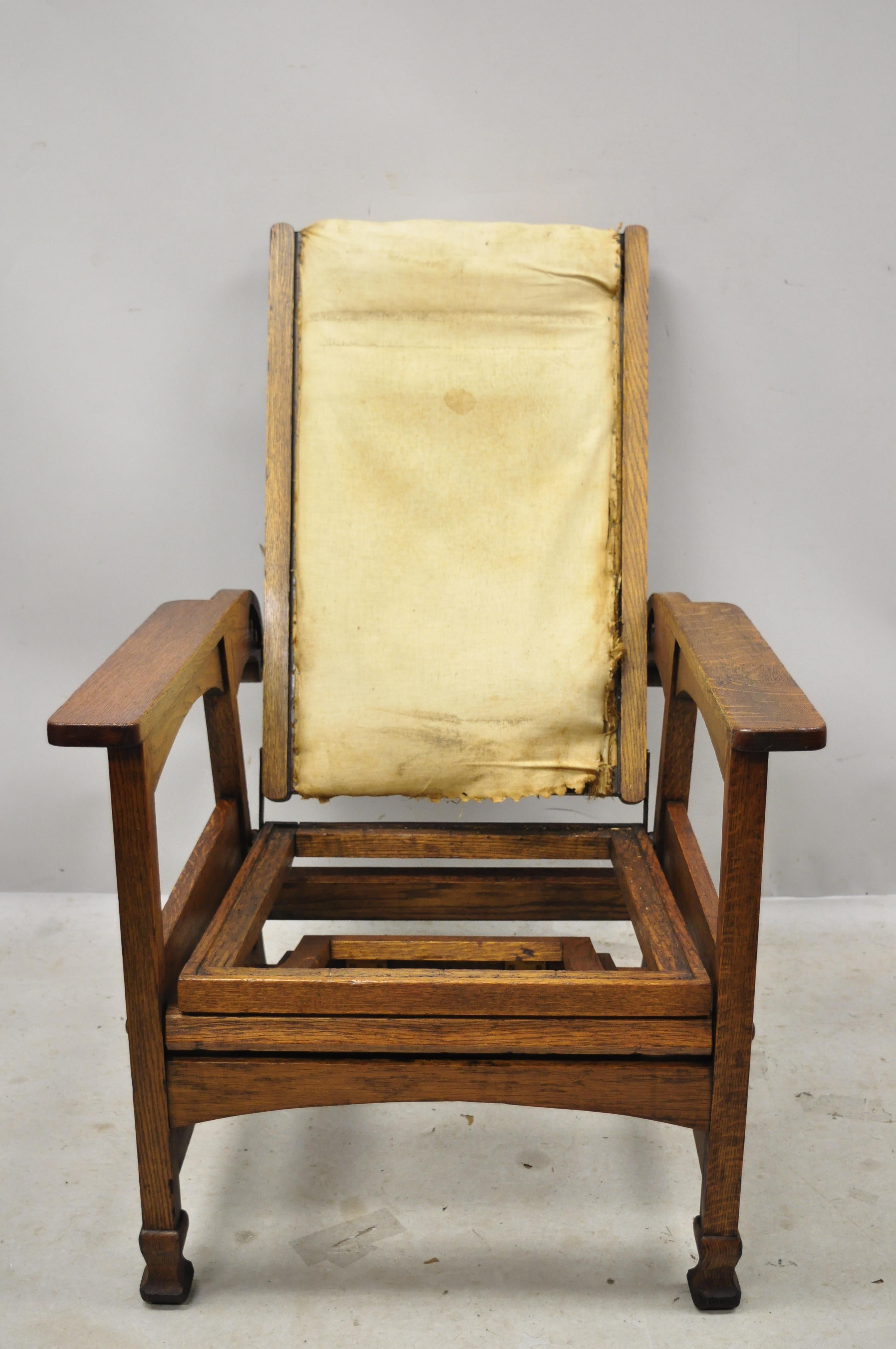 Antique Mission Oak Arts & Crafts reclining Morris chair with fold flip footrest ottoman attributed to Hunzinger. Item features fold out ottoman footrest, adjustable reeling back, solid wood construction, beautiful wood grain, unmarked, very nice